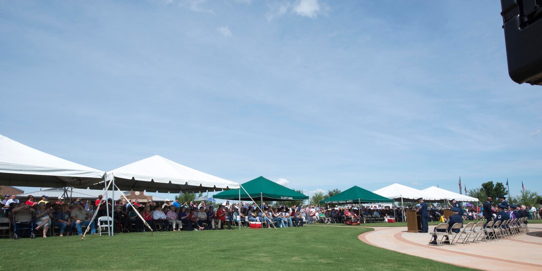 Dyess Airmen and members of the Abilene community gather for a Memorial Day ceremony at the Texas State Veterans Cemetery, Abilene, Texas, May 29, 2017. Every year the Texas State Veterans Cemetery holds a Memorial Day tribute to honor all deceased service members. (U.S. Air Force photo by Senior Airman Austin Mayfield)