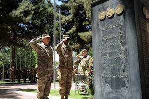 Army Gen. John Nicholson, commander of Resolute Support, pays his respects to service members who made the ultimate sacrifice in Afghanistan during a Memorial Day ceremony in Kabul, Afghanistan.