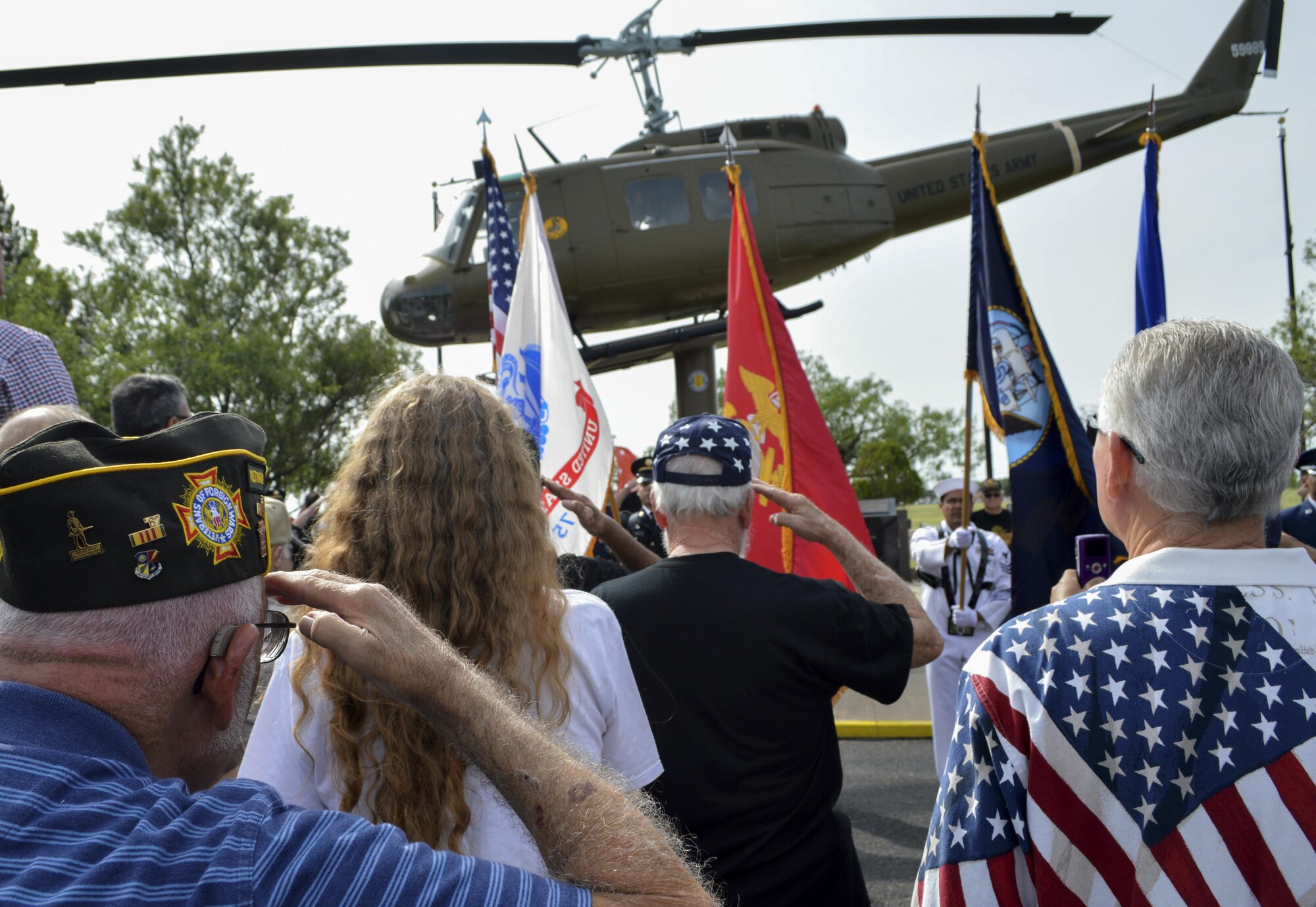 Veterans and civilians salute the posting of the colors as part of a Memorial Day re-dedication ceremony at the San Angelo Regional Airport, Texas, May 29, 2017. The ceremony had guest speakers from Goodfellow Air Force Base and the City of San Angelo. (U.S. Air Force photo by Robert D. Martinez/Released)