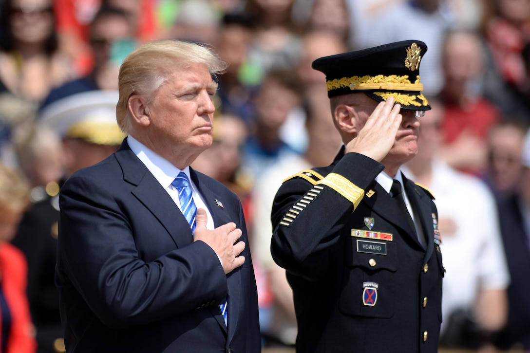 President Donald J. Trump pays his respects after laying a wreath at the Tomb of the Unknowns at Arlington National Cemetery in Arlington, Va., May, 29, 2017. On his right is Maj. Gen. Michael L. Howard, commander of Joint Force Headquarters-National Capital Region and the U.S. Army Military District of Washington. DoD photo by EJ Hersom