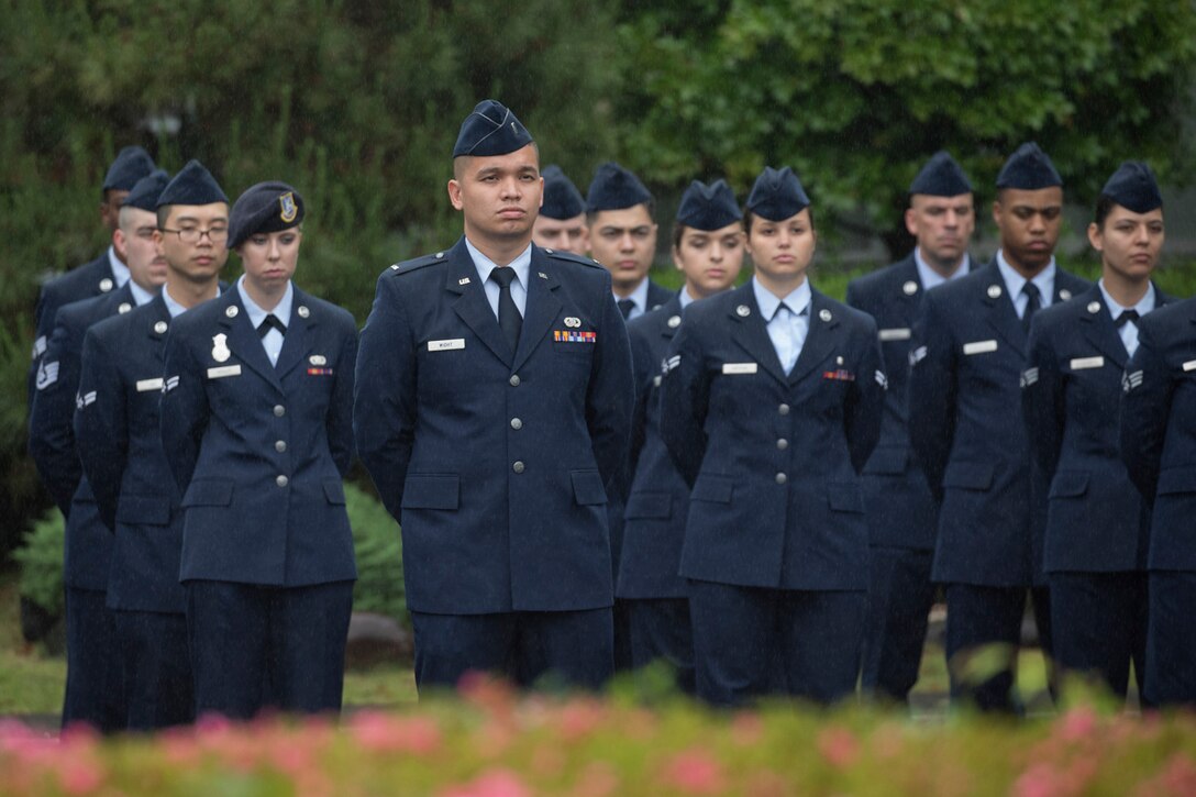 Yokota airmen stand in formation during the Memorial Day ceremony at Yokota Air Base, Japan, May 26, 2017. The 374th Airlift Wing hosted the ceremony in memory of those who made the ultimate sacrifice during military service. (U.S. Air Force photo by Yasuo Osakabe)