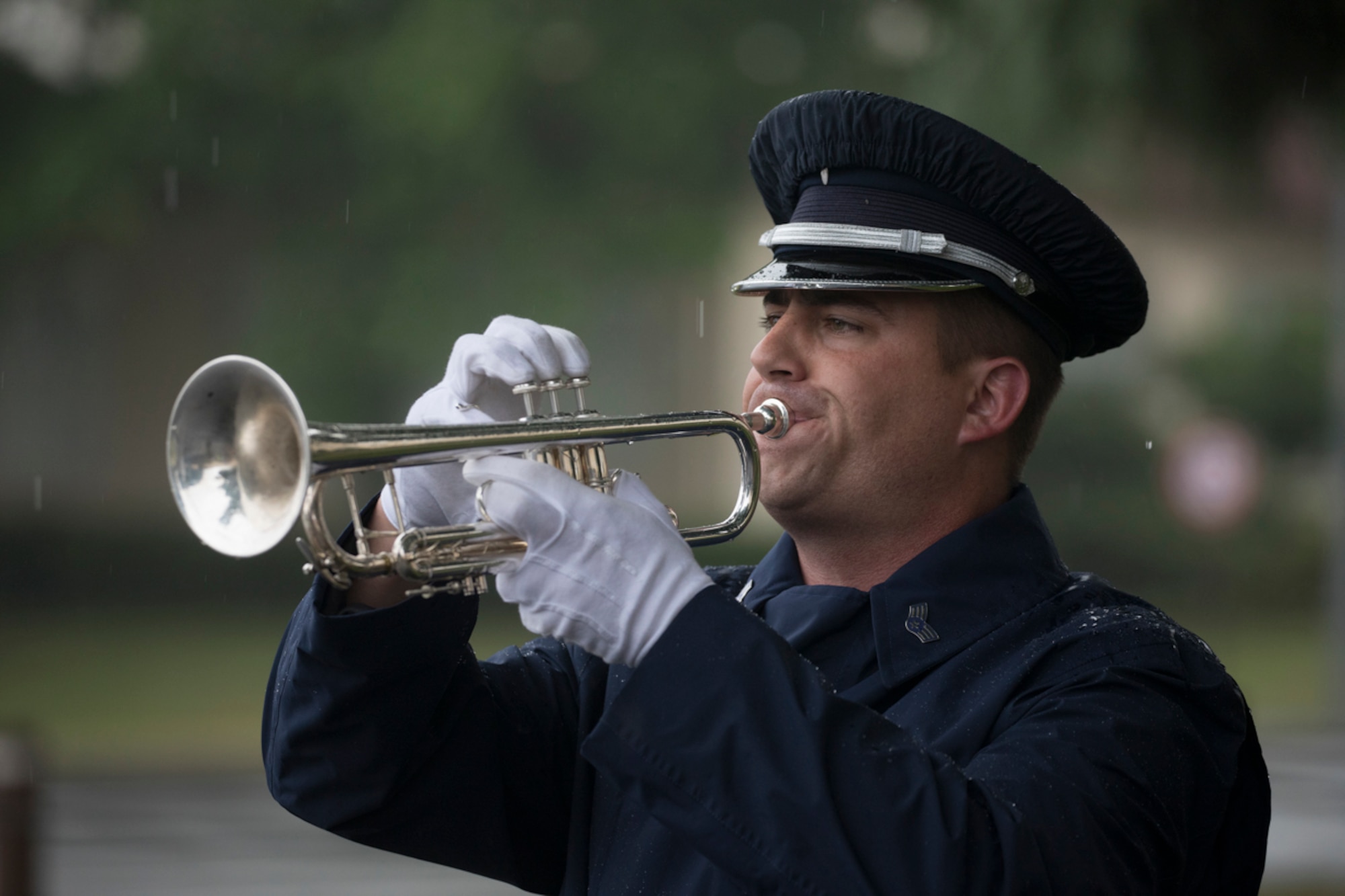 Senior Airman David Wuchter, U.S. Air Force Band of the Pacific-Asia, plays taps during the Memorial Day ceremony at Yokota Air Base, Japan, May 26, 2017. The 374th Airlift Wing held the ceremony in memory of those who have given the ultimate sacrifice while in military service. (U.S. Air Force photo by Yasuo Osakabe)
