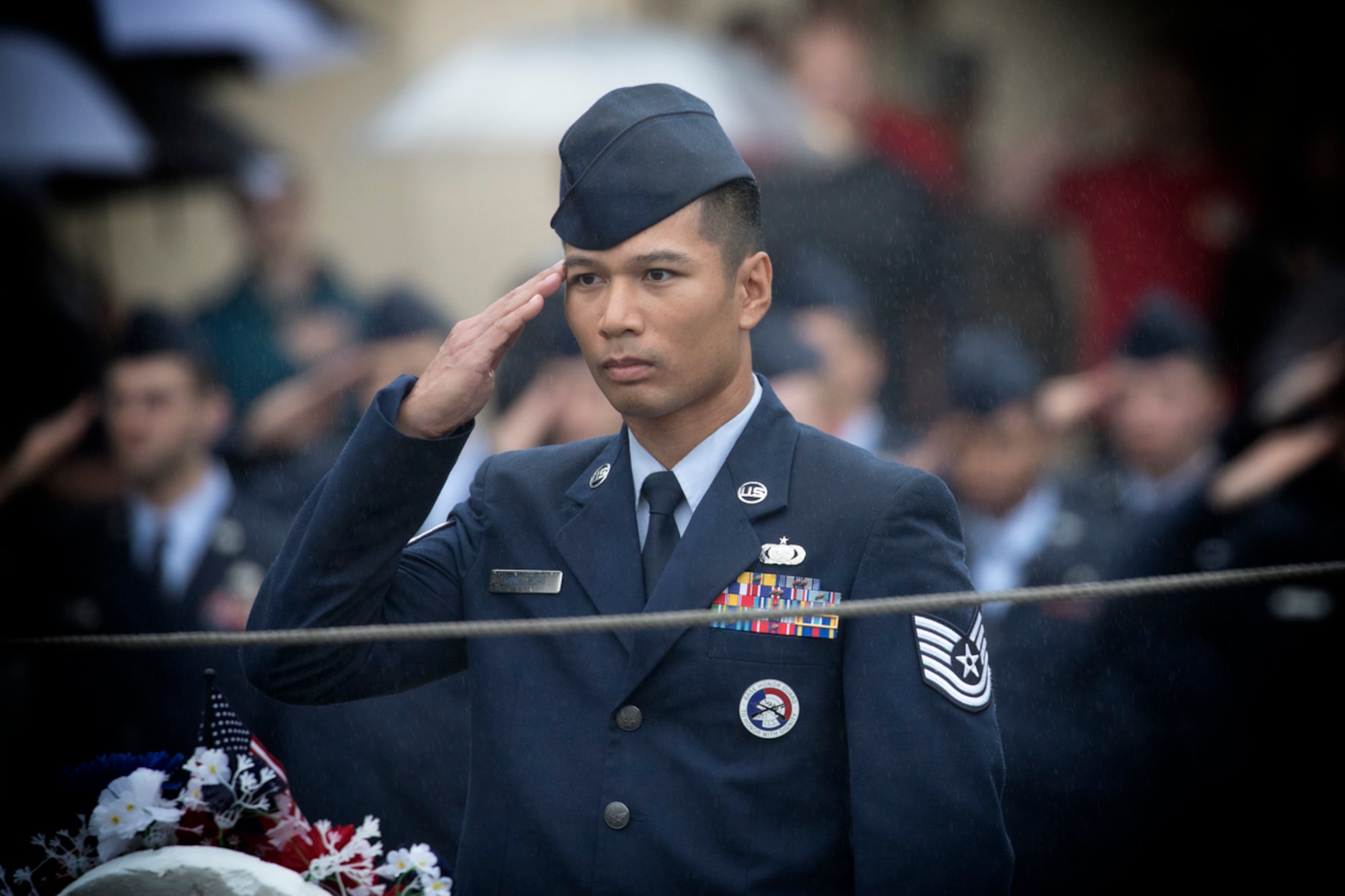 Tech. Sgt. Y Jin Ding Plai, Yokota honor guardsman, renders a salute during the Memorial Day ceremony at Yokota Air Base, Japan, May 26, 2017. The 374th Airlift Wing held the ceremony in memory of those who have given the ultimate sacrifice while in military service. (U.S. Air Force photo by Yasuo Osakabe)