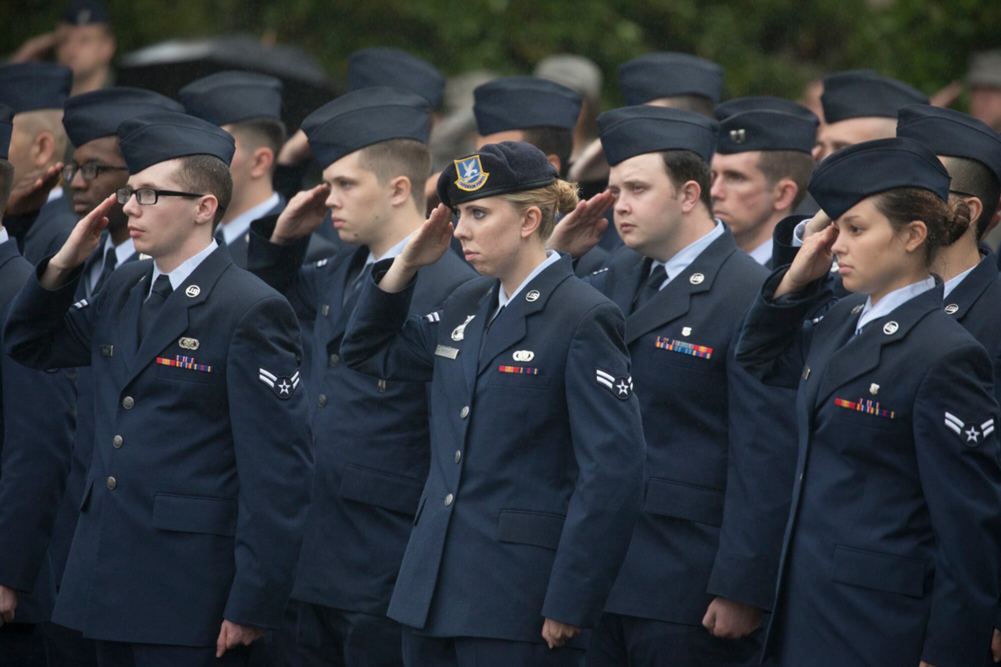 Yokota Airmen salute during a ceremony for Memorial Day at Yokota Air Base, Japan, May 26, 2017. The 374th Airlift Wing held the ceremony in memory of those who have given the ultimate sacrifice while in military service. (U.S. Air Force photo by Yasuo Osakabe)