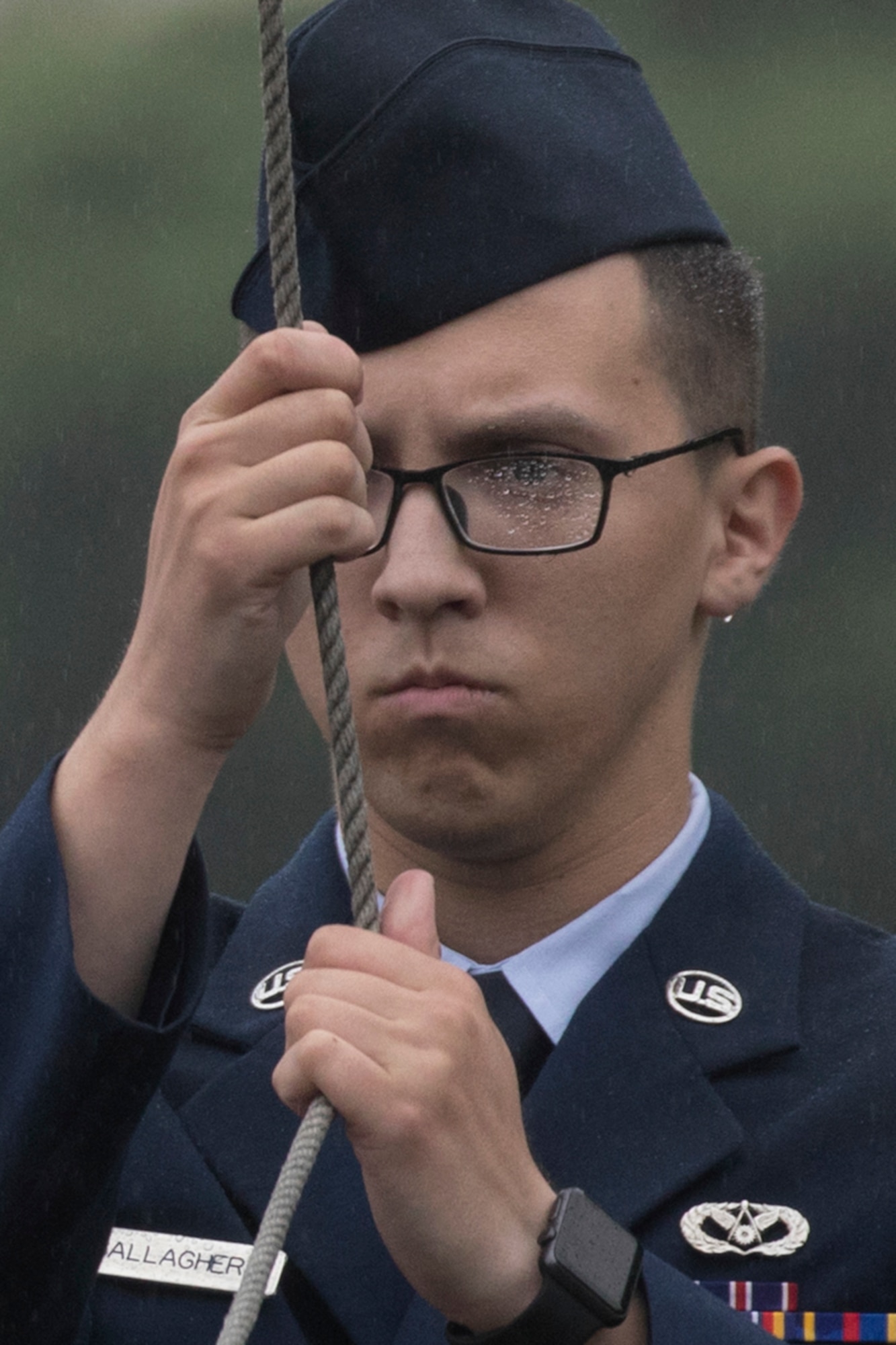 Airman 1st Class Austin Gallagher, Yokota honor guardsman, lowers the U.S. flag during the Memorial Day ceremony at Yokota Air Base, Japan, May 26, 2017. The 374th Airlift Wing held the ceremony in memory of those who have given the ultimate sacrifice while in military service. (U.S. Air Force photo by Yasuo Osakabe)