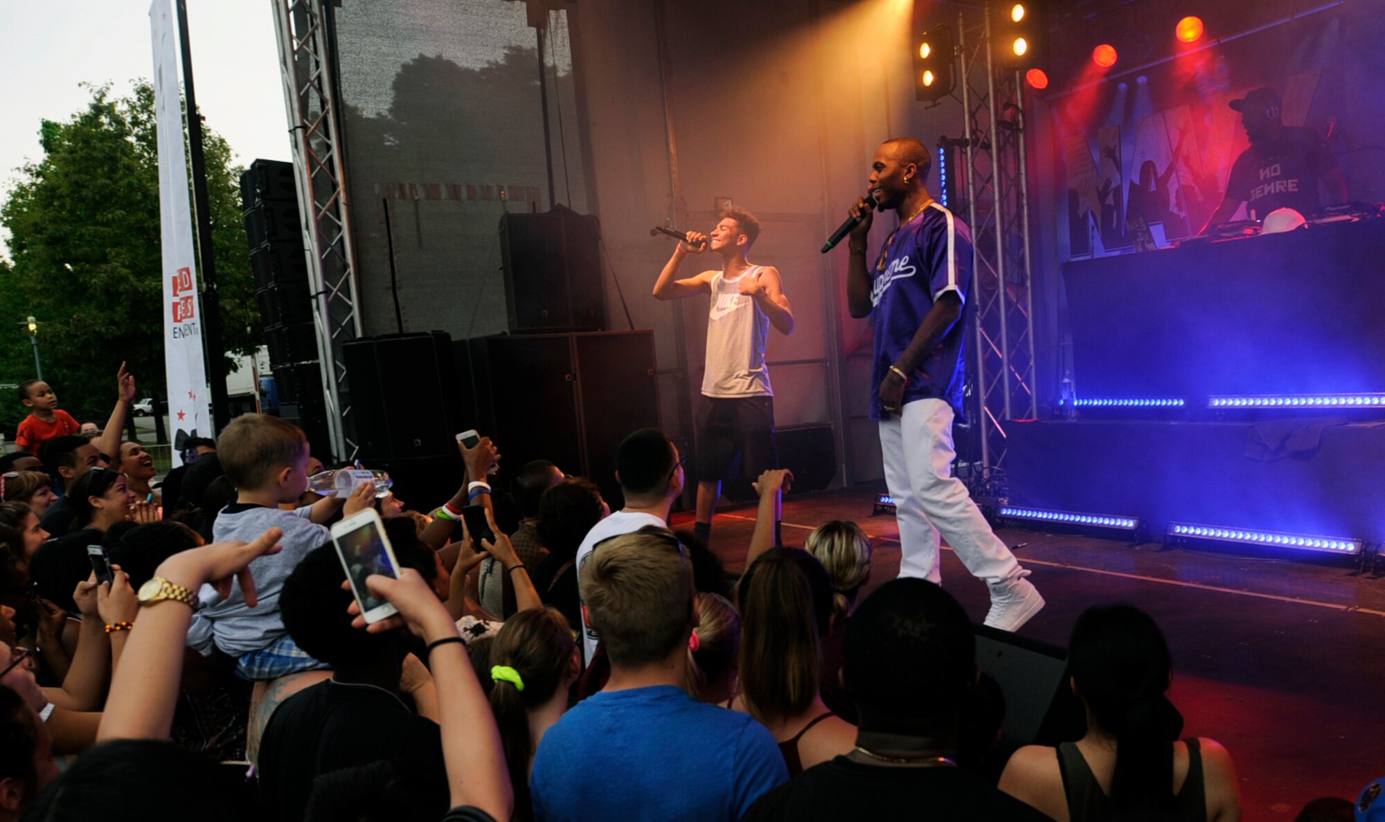 Asiah Shannon, left, son of Tech. Sgt. Kristina Shannon, 86th Communications Squadron postmaster, performs with rapper and music producer B.o.B during a free concert at Ramstein Air Base, Germany, May 28, 2017. The musical artist picked Shannon from the audience and invited him to perform a song. (U.S. Air Force photo/Tech. Sgt. Sharida Jackson)