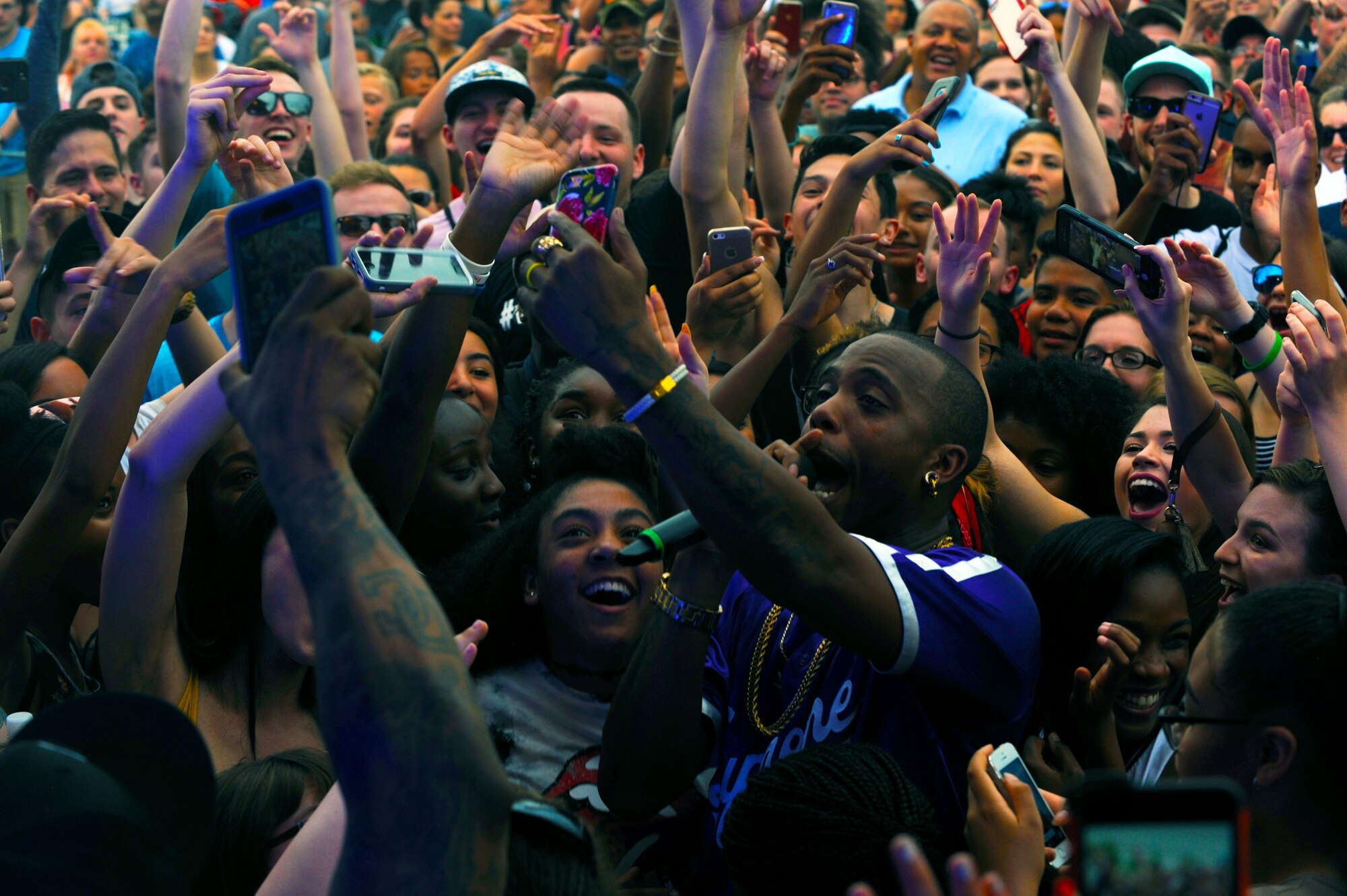 B.o.B, rapper and music producer, interacts with the audience during a performance at Ramstein Air Base, Germany, May 28, 2017. Approximtely 1,000 people attended the free concert provided by Navy Entertainment and Armed Forces Entertainment. (U.S. Air Force photo/Tech. Sgt. Sharida Jackson)