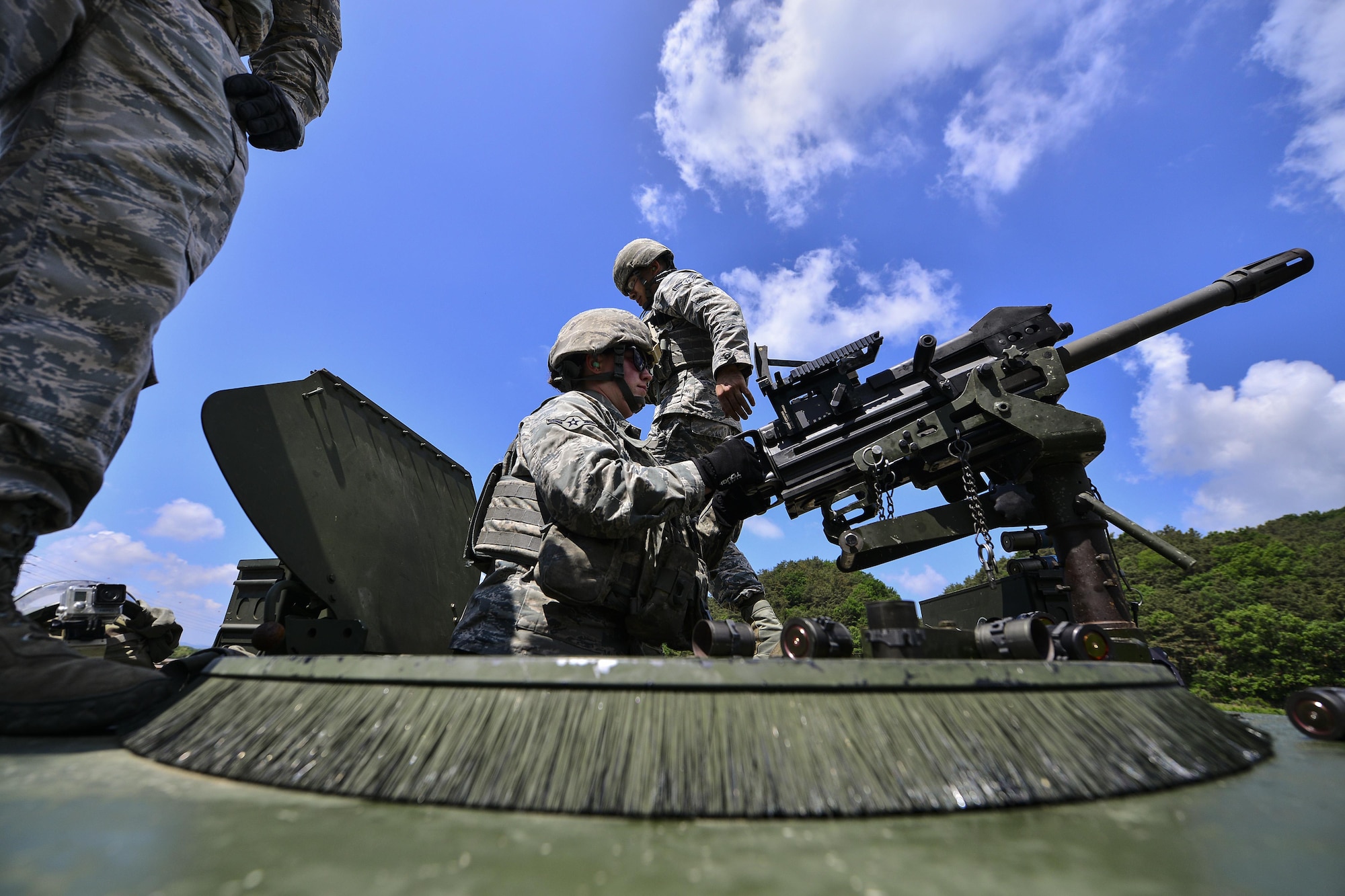 U.S. Air Force Airman Destri Snow, 51st Security Forces Squadron defender, fires an MK-19 grenade launcher during a weapons qualification training at Camp Rodriguez, Republic of Korea, May 24, 2017. The training ensures that Defenders are vigilant and always ready to ‘Fight Tonight.’ (U.S. Air Force photo by Airman 1st Class Gwendalyn Smith)