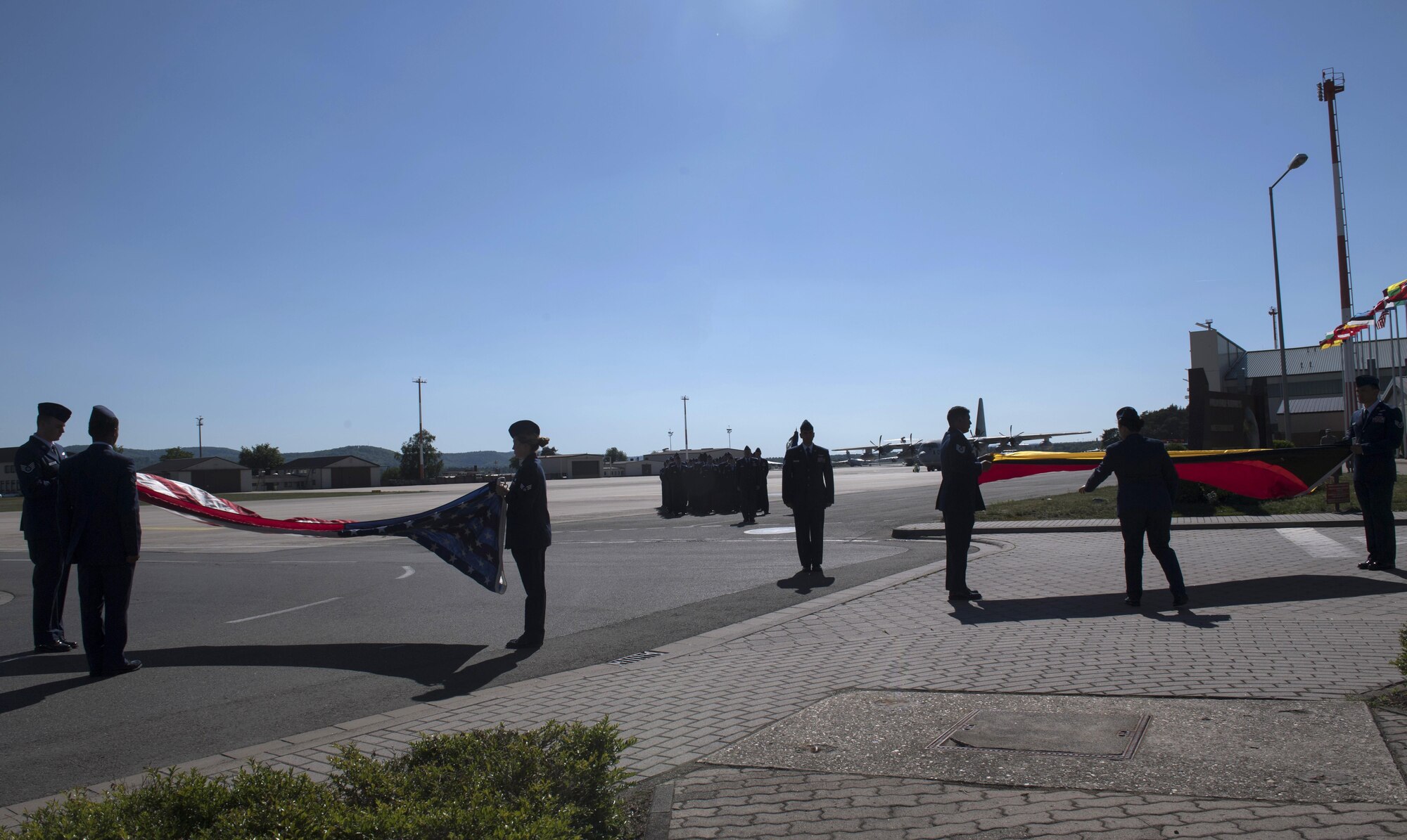U.S. Air Force Airman assigned to the 86th Operations Group fold the U.S. and German flags during a Memorial Retreat Ceremony on Ramstein Air Base, Germany, May 26, 2017. Airmen from four different squadrons within the 86th OG participated in the ceremony. (U.S Air Force photo by Senior Airman Tryphena Mayhugh)