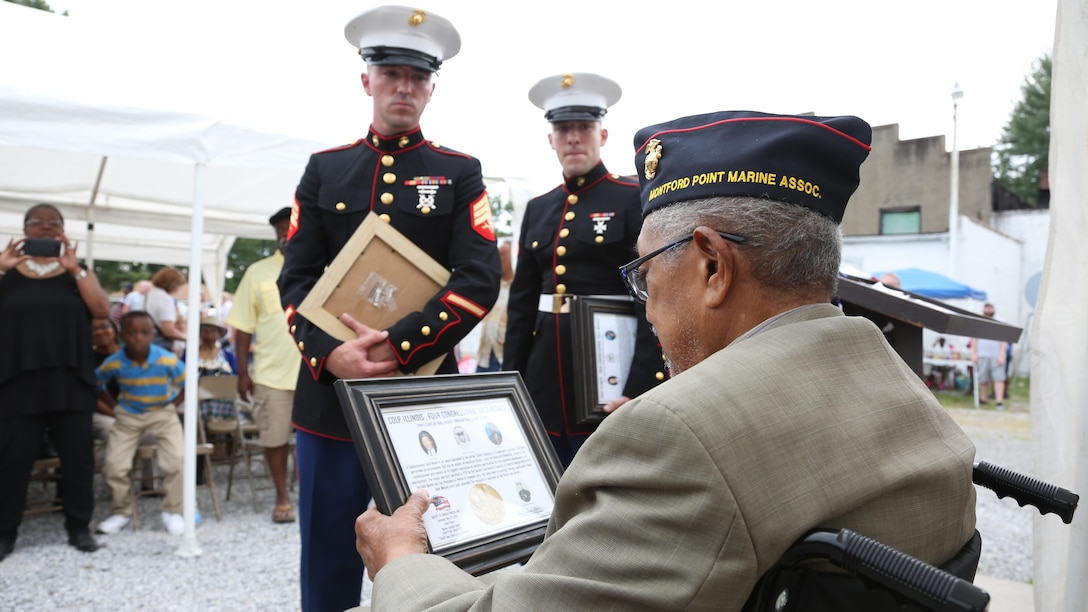 Sergeant Mike Stachowski greets Archibald Mosley, May 27, at the Colp Area Veterans Celebration, Dedication and Remembrance Ceremony, in Colp, Illinois. The ceremony honored fallen service members, Mosley and three other African American Marines from Colp, who were among the first black Americans to join Marine Corps during World War II. They became known as the Montford Point Marines. Nearly 20,000 African-Americans joined the Marine Corps in 1942, after President Franklin D. Roosevelt issued a “presidential directive giving African Americans an opportunity to be recruited in the Marine Corps,” according to the Montford Point Marines Association website. They didn’t receive recruit training at San Diego or Parris Island, however, but Camp Montford Point, N.C., a segregated training site for African American Marine recruits. For the next seven years, the camp remained opened until it became desegregated. The four Marines are Sol Griffin, Jr.; James L. Kirby, Early Taylor, Jr. and Archibald Mosley. These Marines, among many other Montford Point Marines across the country, were awarded the Congressional Gold Medal, the highest award that can be given to a civilian by Congress, in 2012. 