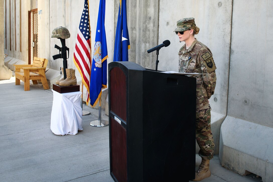 Air Force Senior Airman Jessica Hubbard remembers a fallen comrade, Senior Airman Jason Cunningham during a Memorial Day ceremony at Bagram Airfield, Afghanistan, May 29, 2017. Hubbard is assigned to the 455th Expeditionary Medical Group. Cunningham was a pararescueman who lost his life while saving the lives of ten service members under heavy enemy fire, March 4, 2002. Air Force photo by Staff Sgt. Benjamin Gonsier