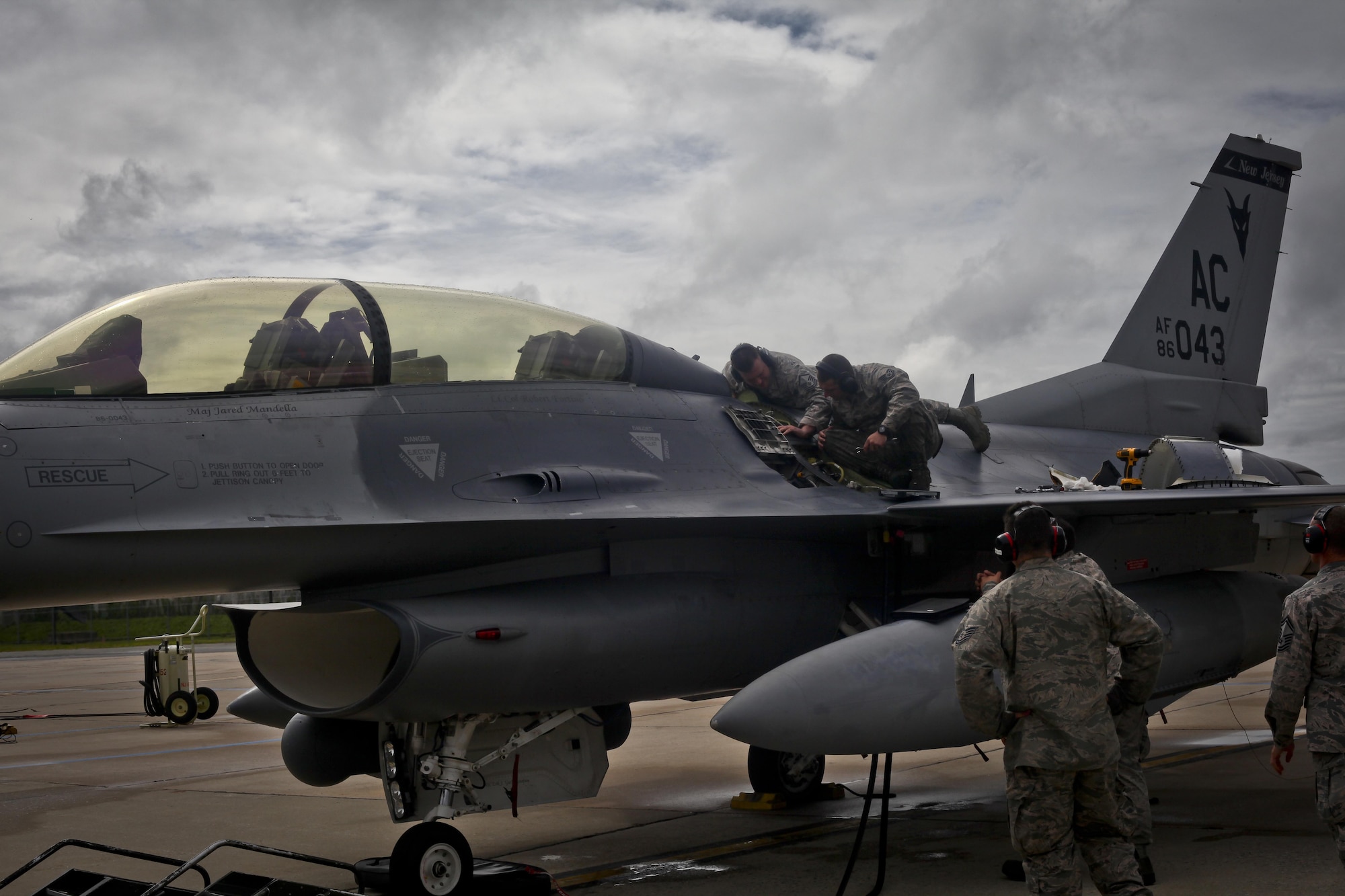 A New Jersey National Guard F-16D Fighting Falcon from the 177th Fighter Wing is worked on prior to a mission during a three-day Aeropsace Control Alert CrossTell live-fly training exercise at Atlantic City Air National Guard Base, N.J., May 24, 2017. Representatives from the Air National Guard fighter wings, Civil Air Patrol, and U.S. Coast Guard rotary-wing air intercept units will conduct daily sorties from May 23-25 to hone their skills with tactical-level air-intercept procedures. (U.S. Air National Guard photo by Master Sgt. Matt Hecht/Released)
