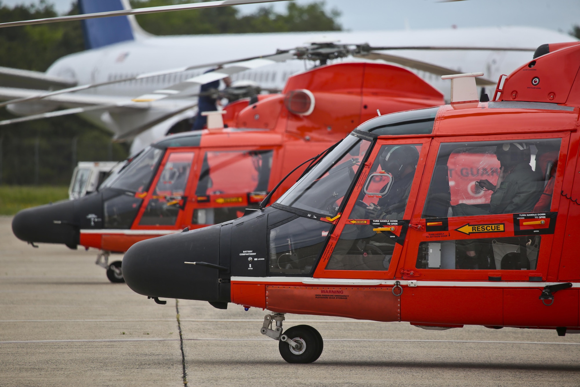 U.S. Coast Guard HH-65C Dolphin helicopters from Coast Guard Air Station Atlantic City are prepared for a mission during a three-day Aeropsace Control Alert CrossTell live-fly training exercise at Atlantic City International Airport, N.J., May 24, 2017. Representatives from the Air National Guard fighter wings, Civil Air Patrol, and U.S. Coast Guard rotary-wing air intercept units will conduct daily sorties from May 23-25 to hone their skills with tactical-level air-intercept procedures. (U.S. Air National Guard photo by Master Sgt. Matt Hecht/Released)