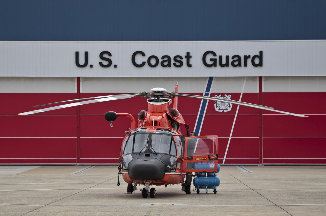 A U.S. Coast Guard HH-65C Dolphin helicopter from Coast Guard Air Station Atlantic City is prepared for a mission during a three-day Aeropsace Control Alert CrossTell live-fly training exercise at Atlantic City International Airport, N.J., May 24, 2017. Representatives from the Air National Guard fighter wings, Civil Air Patrol, and U.S. Coast Guard rotary-wing air intercept units will conduct daily sorties from May 23-25 to hone their skills with tactical-level air-intercept procedures. (U.S. Air National Guard photo by Master Sgt. Matt Hecht/Released)