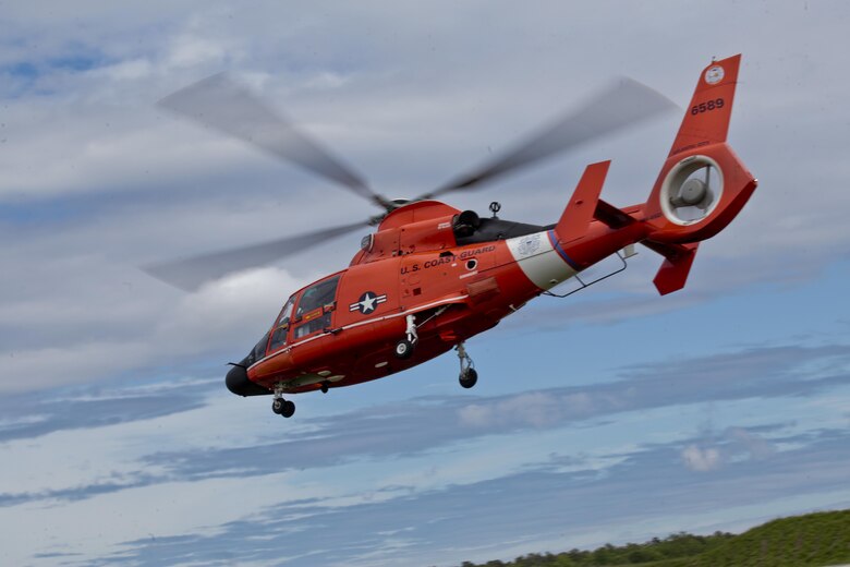 A U.S. Coast Guard HH-65C Dolphin helicopter from Coast Guard Air Station Atlantic City takes off during a three-day Aeropsace Control Alert CrossTell live-fly training exercise at Atlantic City International Airport, N.J., May 24, 2017. Representatives from the Air National Guard fighter wings, Civil Air Patrol, and U.S. Coast Guard rotary-wing air intercept units will conduct daily sorties from May 23-25 to hone their skills with tactical-level air-intercept procedures. (U.S. Air National Guard photo by Master Sgt. Matt Hecht/Released)