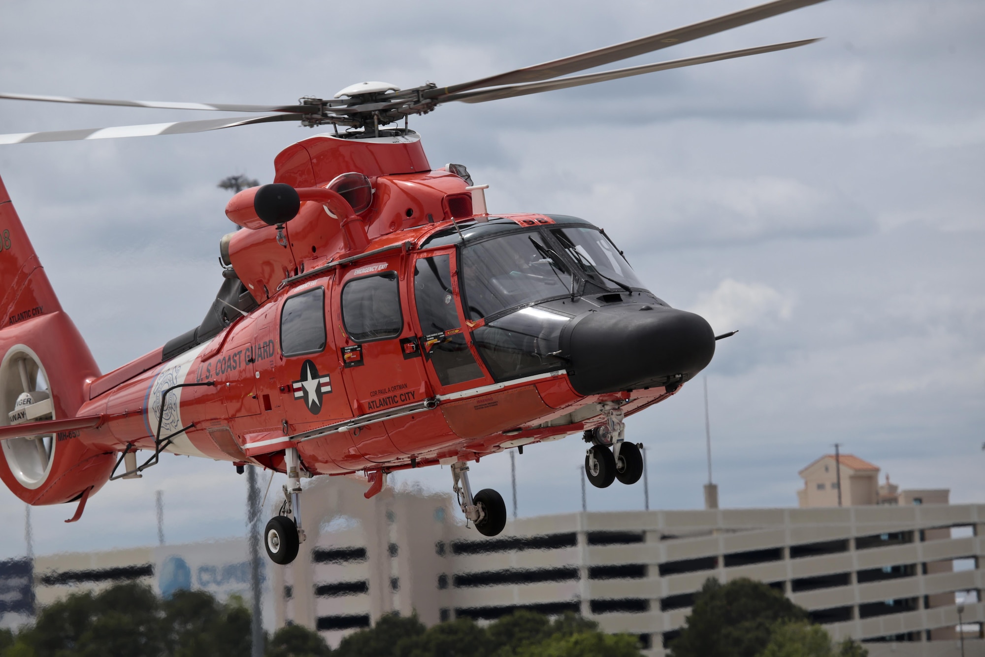 A U.S. Coast Guard HH-65C Dolphin helicopter from Coast Guard Air Station Atlantic City takes off during a three-day Aeropsace Control Alert CrossTell live-fly training exercise at Atlantic City International Airport, N.J., May 24, 2017. Representatives from the Air National Guard fighter wings, Civil Air Patrol, and U.S. Coast Guard rotary-wing air intercept units will conduct daily sorties from May 23-25 to hone their skills with tactical-level air-intercept procedures. (U.S. Air National Guard photo by Master Sgt. Matt Hecht/Released)