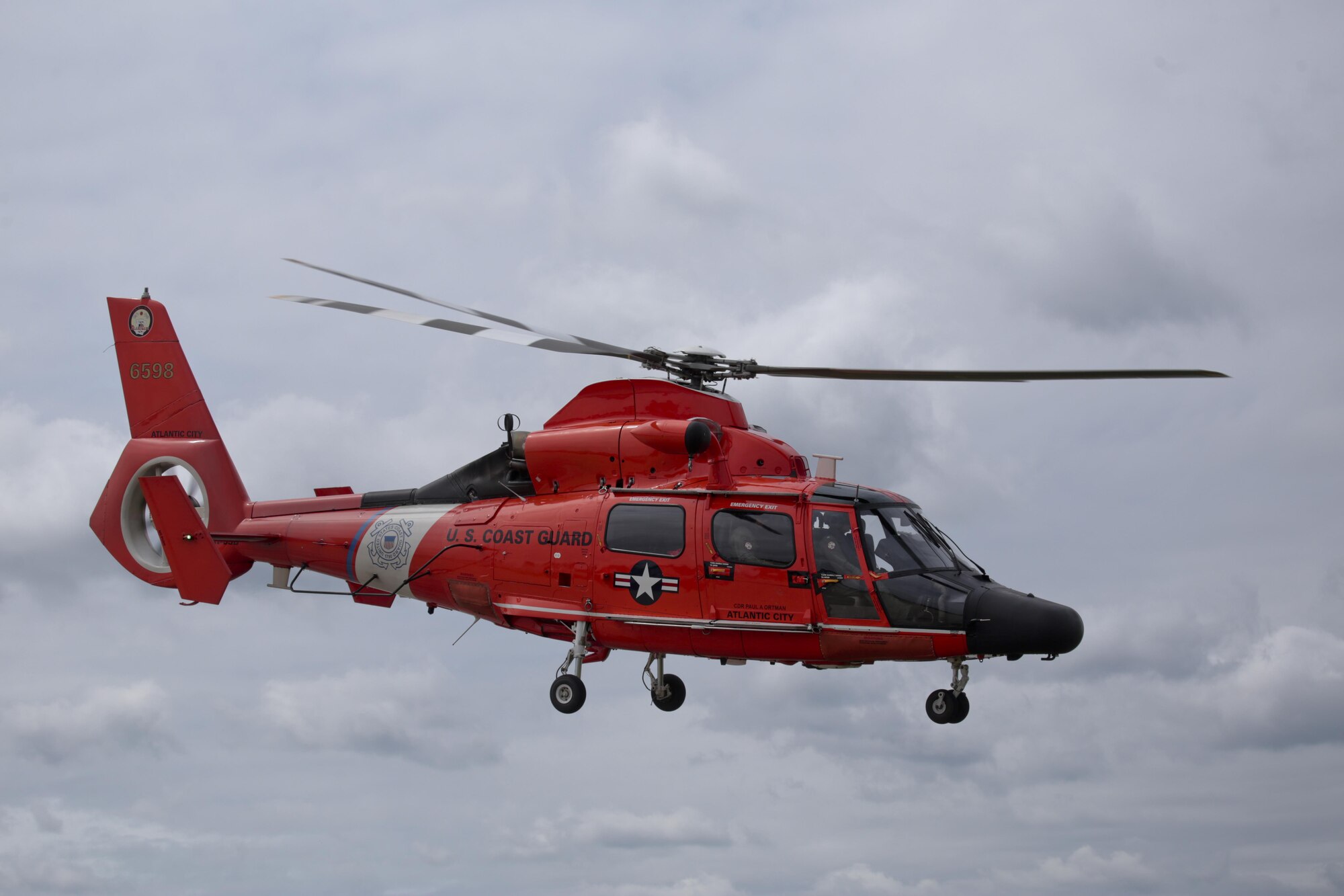 A U.S. Coast Guard HH-65C Dolphin helicopter from Coast Guard Air Station Atlantic City takes off during a three-day Aeropsace Control Alert CrossTell live-fly training exercise at Atlantic City International Airport, N.J., May 24, 2017. Representatives from the Air National Guard fighter wings, Civil Air Patrol, and U.S. Coast Guard rotary-wing air intercept units will conduct daily sorties from May 23-25 to hone their skills with tactical-level air-intercept procedures. (U.S. Air National Guard photo by Master Sgt. Matt Hecht/Released)