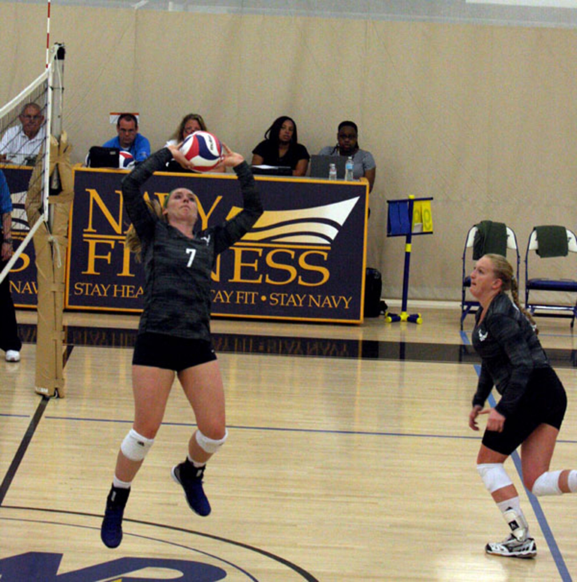 2nd Lt. Hillary Keltner of the 1st Space Operations Squadron at Schriever Air Force Base, Colorado, sets the ball during Air Force’s match against Navy during the Armed Forces Volleyball Championship at Naval Station Mayport, Florida. (U.S. Air Force photo by Steve Brown)