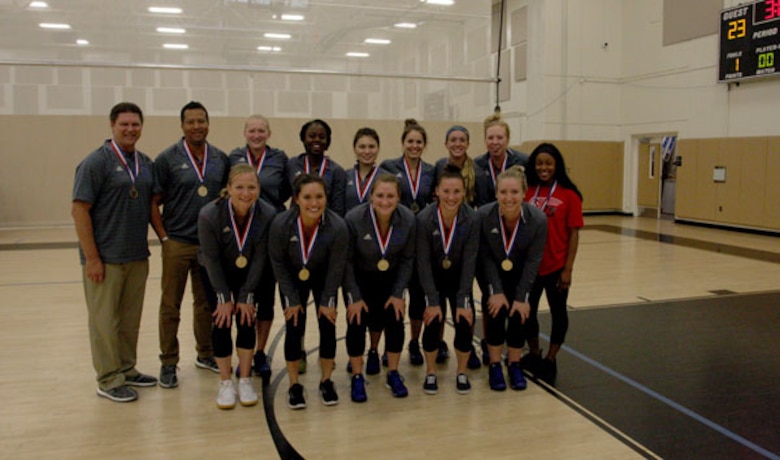 The All-Air Force volleyball team poses with their gold medals after winning the Armed Forces Volleyball Championship. (U.S. Air Force photo by Steve Brown)