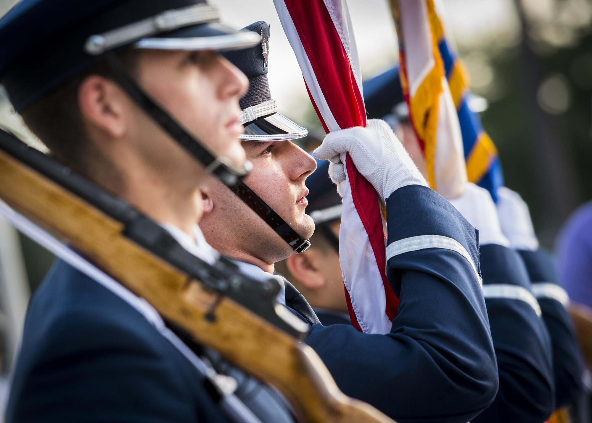 Senior Airman Aaron Lawlor, a 96th Test Wing Honor Guard member, holds the American Flag prior to National Anthem at the 32nd annual Gate to Gate run at Eglin Air Force Base, Fla., May 27.  More than 900 people participated at this year’s event.  (U.S. Air Force photo/Samuel King Jr.)