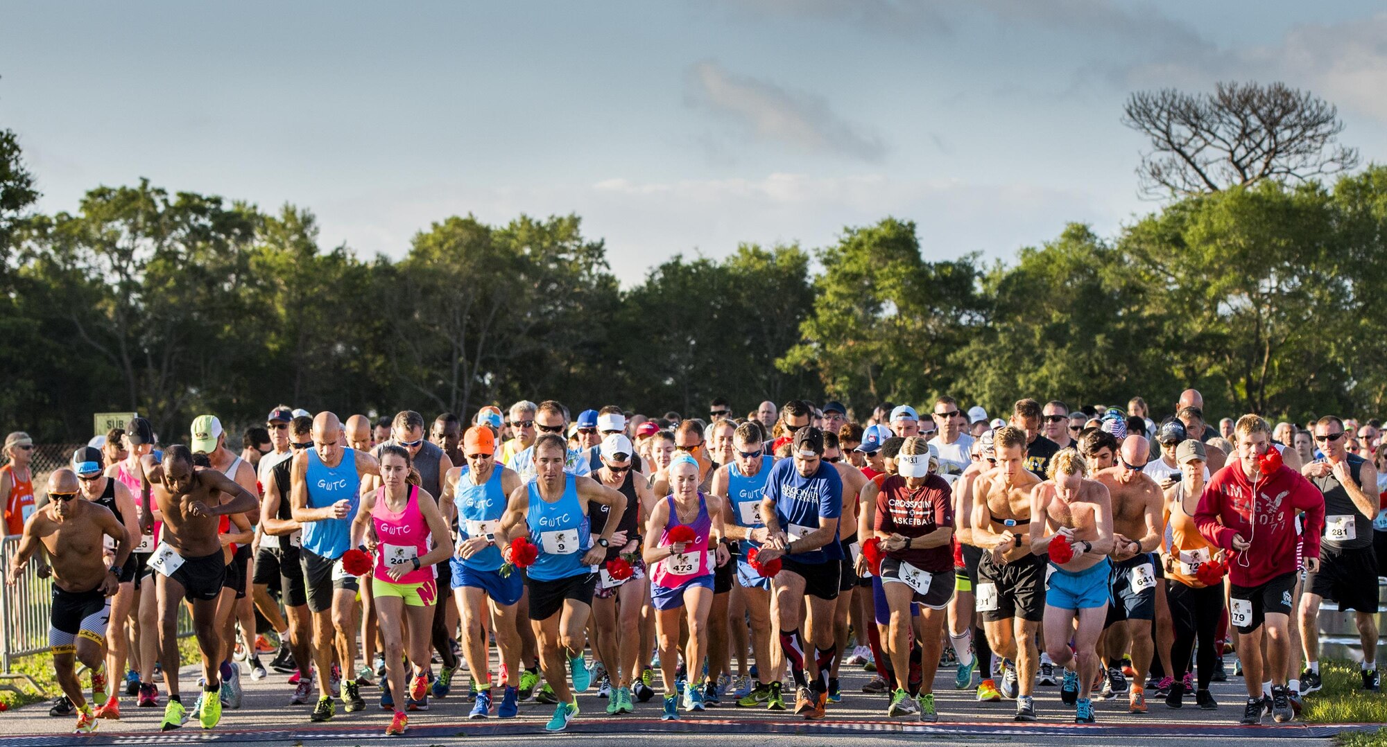The runners take off as the 32nd annual Gate to Gate run begins at Eglin Air Force Base, Fla., May 27.  More than 900 people participated at this year’s event.  (U.S. Air Force photo/Samuel King Jr.)