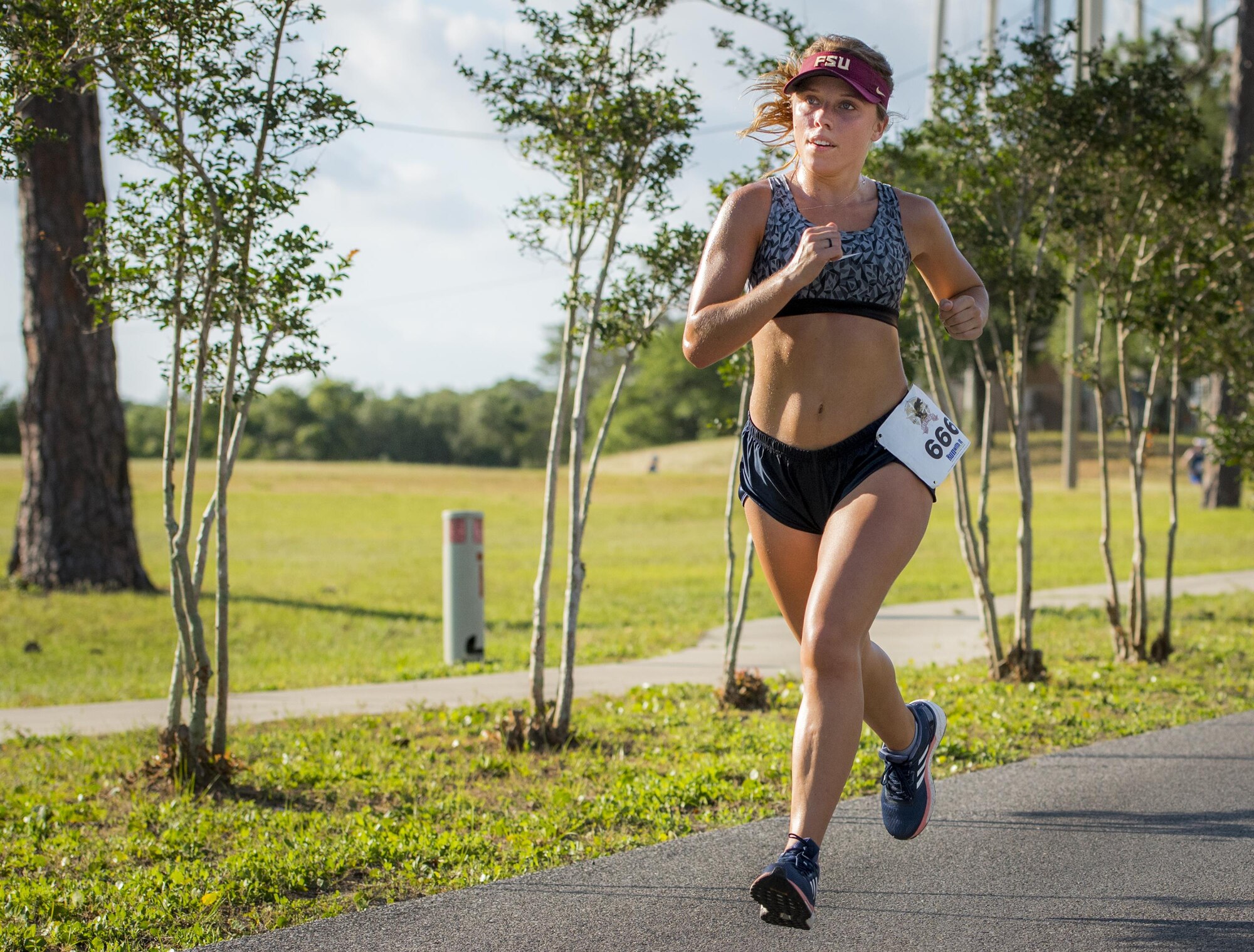 Sara Steele sprints for the finish line of the 32nd annual Gate to Gate run at Eglin Air Force Base, Fla., May 27.  Steele finished first in her age group at 30 minutes 12 seconds.  More than 900 people participated at this year’s event.  (U.S. Air Force photo/Samuel King Jr.)