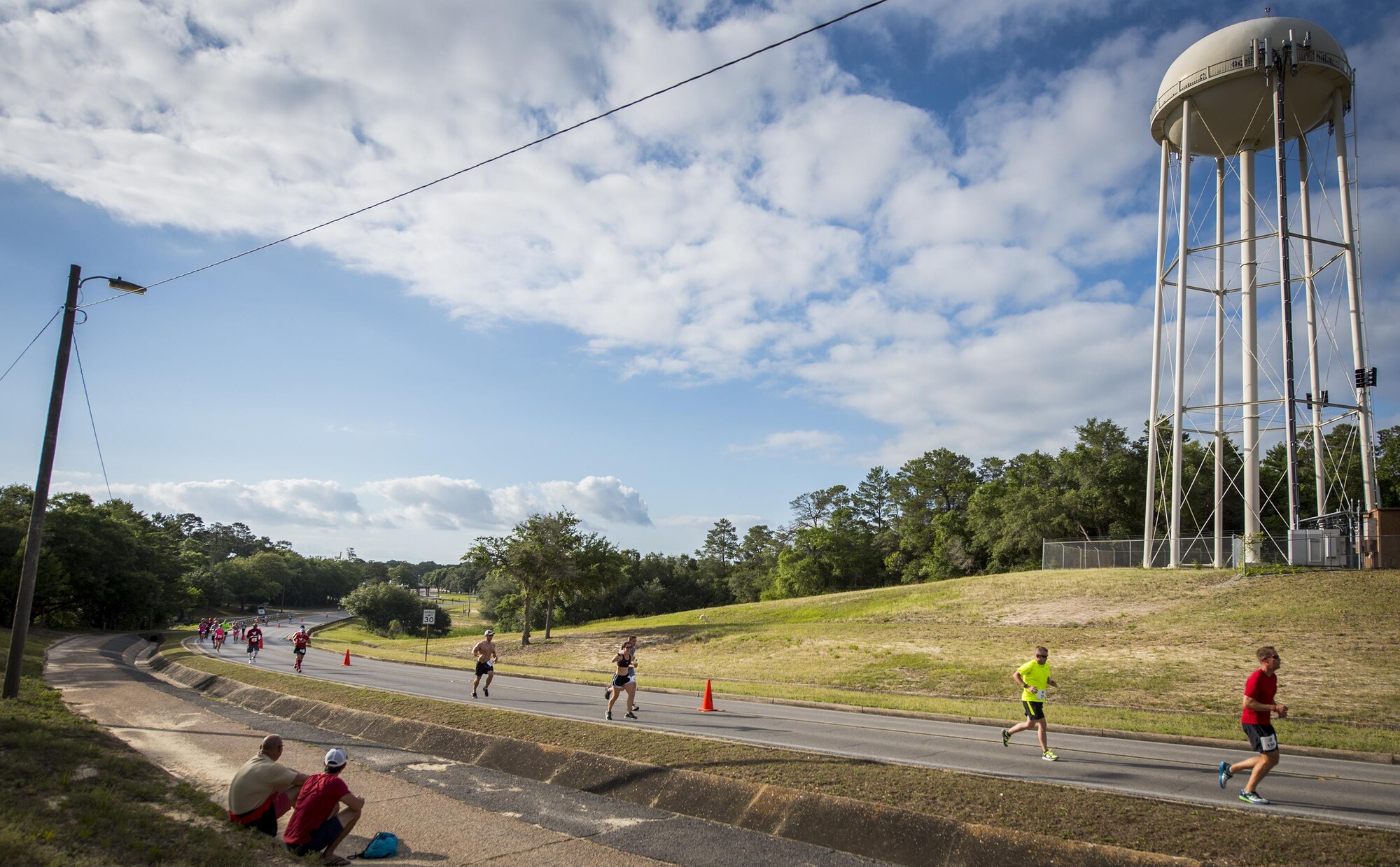 Runners climb the monster hill leading to the finish line of the 32nd annual Gate to Gate run at Eglin Air Force Base, Fla., May 27.  More than 900 people participated at this year’s event.  (U.S. Air Force photo/Samuel King Jr.)