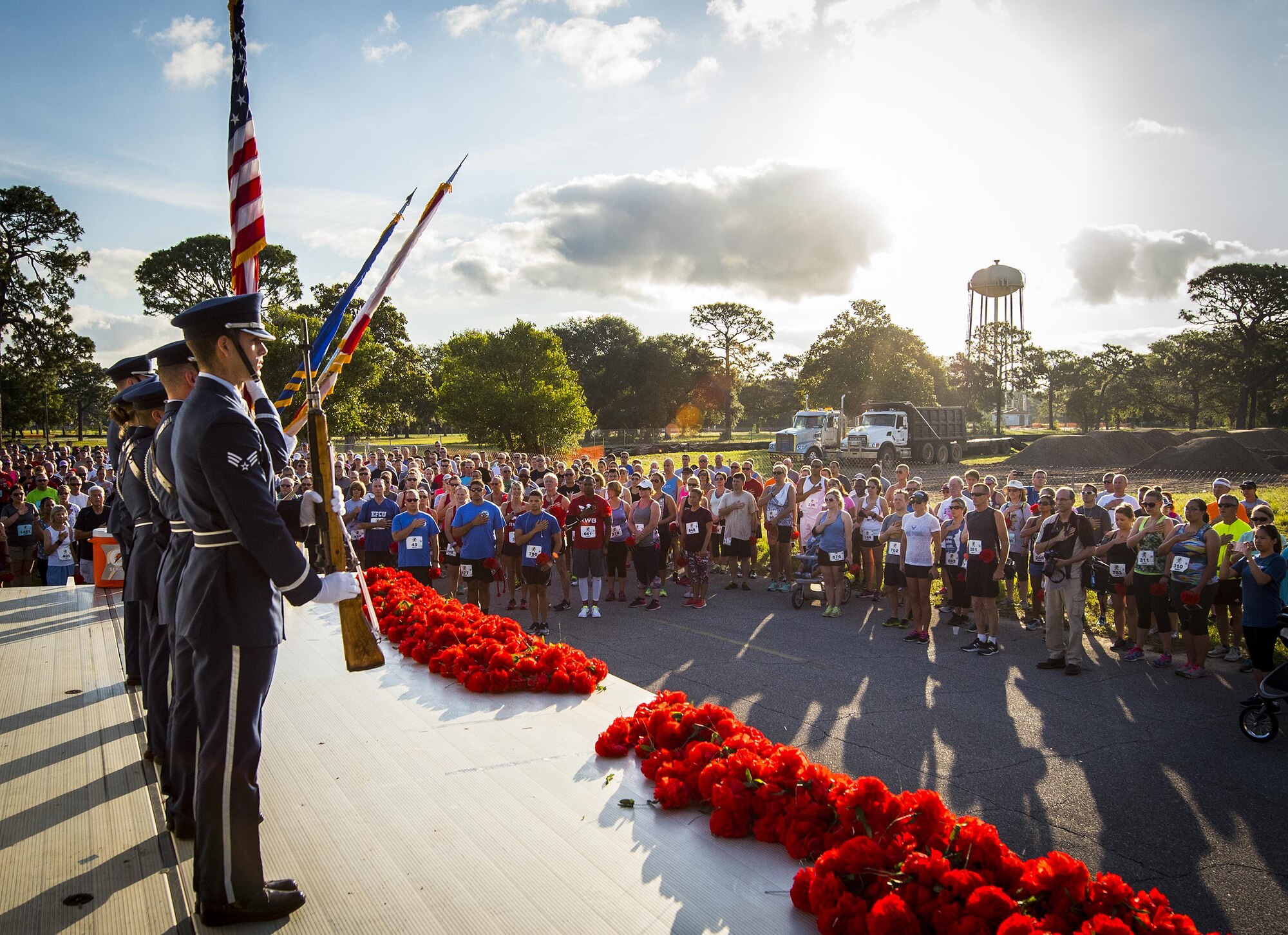 Honor Guard Airmen present the colors during the National Anthem at the 32nd annual Gate to Gate run at Eglin Air Force Base, Fla., May 27.  More than 900 people participated at this year’s event.  (U.S. Air Force photo/Samuel King Jr.)