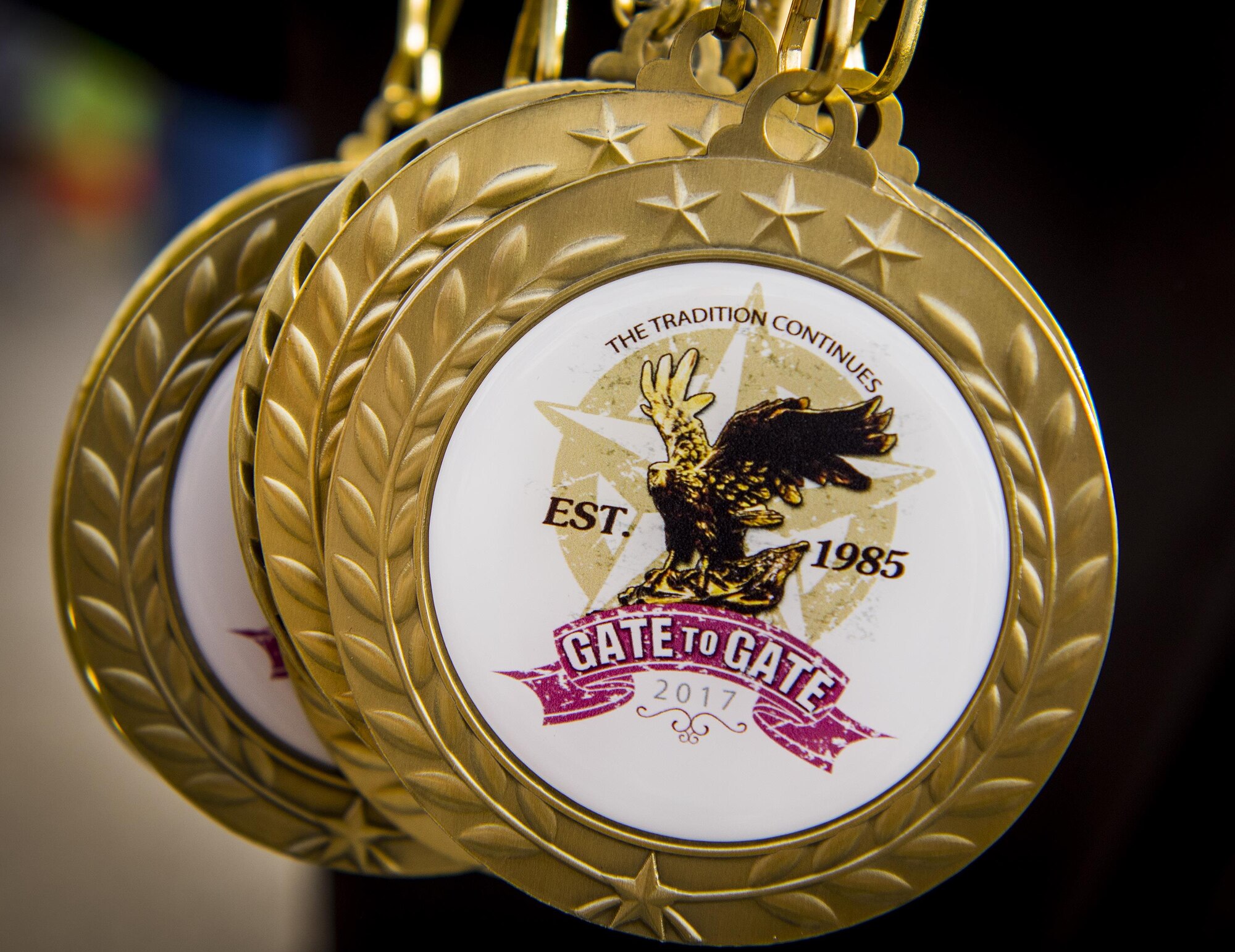 Each participant received a completion medal as they crossed the finish line at the 32nd annual Gate to Gate run at Eglin Air Force Base, Fla., May 27.  More than 900 people participated at this year’s event.  (U.S. Air Force photo/Samuel King Jr.)
