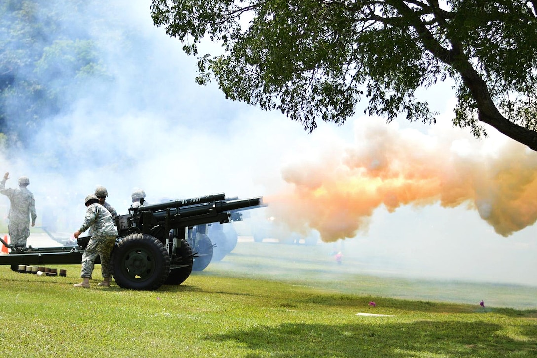 Soldiers fire ceremonial cannons during a Memorial Day ceremony at the National Cemetery in Bayamon, Puerto Rico, May 29, 2017. The soldiers are assigned to the Puerto Rico Army National Guard’s 480th Military Police Company. Army photo by Spc. Anthony Martinez