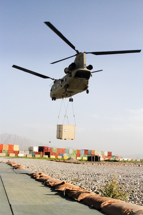 A CH-47 Chinook helicopter takes off after receiving a container during slingload operations at Bagram Airfield, Afghanistan, May 22, 2017. Army photo by Sgt. 1st Class Shelia Cooper