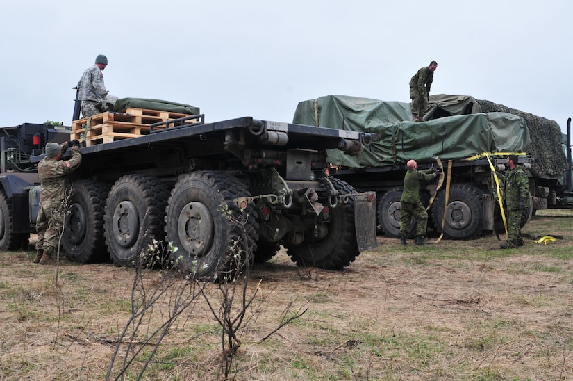 Army Reserve Soldiers with the 993rd Transportation Company from Palatka, Florida, transfer rations to Canadian troops from 2 Service Battalion during Maple Resolve 17 at Camp Wainwright, Alberta, Canada on May 24, 2017.  The U.S. military is providing a wide array of combat and support elements for the Canadian Army’s premier brigade-level validation exercise designed to enhance unit readiness and interoperability. (U.S. Army photo by Sgt. Sarah Zaler)