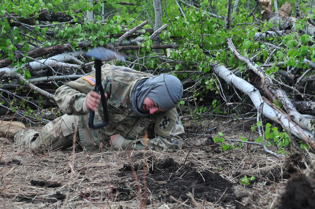 Pfc. Bradley Dodson, a maintenance mechanic from Ocala, Florida, digs a foxhole during Maple Resolve 17 at Camp Wainwright, Alberta, Canada, on May 24, 2017. Dodson’s unit, the 993rd Transportation Company, provided logistical and security support during the Canadian Army’s premier brigade-level validation exercise running 14-29 May.