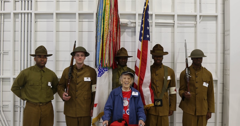 U.S. Army Reserve Spc. Brandon Mosley, Spc. Kyle McCracken, Spc. Randy Davis, Spc. Christopher Hunter and Spc. Rashad Roberts, all with the 90th Sustainment Brigade based out of Little Rock, Ark., pause for a photograph with  Army Corps of Nurses 1st Lt. (Ret.) Josephine Reaves at a World War I commemoration event in San Antonio, Texas at Brooks City Base Hangar 9 on Saturday, May 20, 2017. The event was hosted by the City of San Antonio Department of Military Affairs to honor those who served in World War I. (U.S. Army Reserve photo by Spc. Kati Waxler)