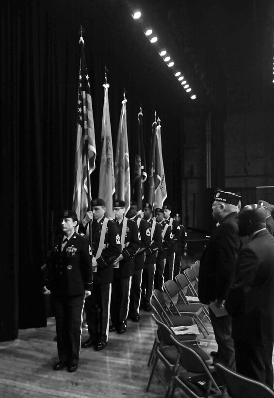 U.S. Army Reserve Master Sgt. Kimberly Jones, leads a Color Guard of the Headquarters and Headquarters Company, 412th Theater Engineer Command, based in Vicksburg, Miss., as it posts the Colors during the 38th-annual Memorial Day Memorial Service in the Vicksburg City Auditorium May 29, 2017. The Color Guard is 1st Sgt. Richard Broussard, Master Sgt. Michael Christy, Sgt. 1st Class Cornelius Joyner , Staff Sgt. Bollis, Sgt. 1st Class Jeremy Reed, Sgt. Gustavo Salazar, Sgt. 1st Class Laverne Cohill and Capt. Adam Corley. (U.S. Army Reserve Photo by Sgt. 1st Class Clinton Wood).