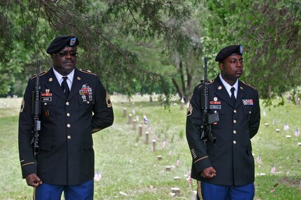 U.S. Army Reserve Sgt. 1st Class Cornelius Joyner, left, and Staff. Sgt. Bolls, both with Headquarters and Headquarters Company, 412th Theater Engineer Command, based in Vicksburg, Miss., were among seven company Soldiers who performed a 21-gun salute at the Vicksburg National Cemetery Memorial Day Observance May 29, 2017. (U.S. Army Reserve Photo by Sgt. 1st Class Clinton Wood)