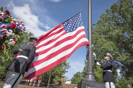 Two Clemson University Reserve Officers’ Training Corps cadets bring in the American flag during a Memorial Day observance in Clemson’s Memorial Park, May 28, 2017. (U.S. Army Reserve photo by Staff Sgt. Ken Scar)