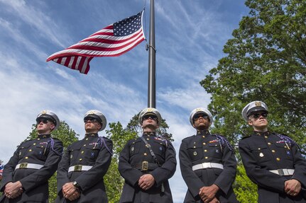 Clemson University Reserve Officers’ Training Corps cadets with the Clemson honor guard the Pershing Rifles stand under the American flag during a Memorial Day observance in Clemson’s Memorial Park, May 28, 2017. (U.S. Army Reserve photo by Staff Sgt. Ken Scar)