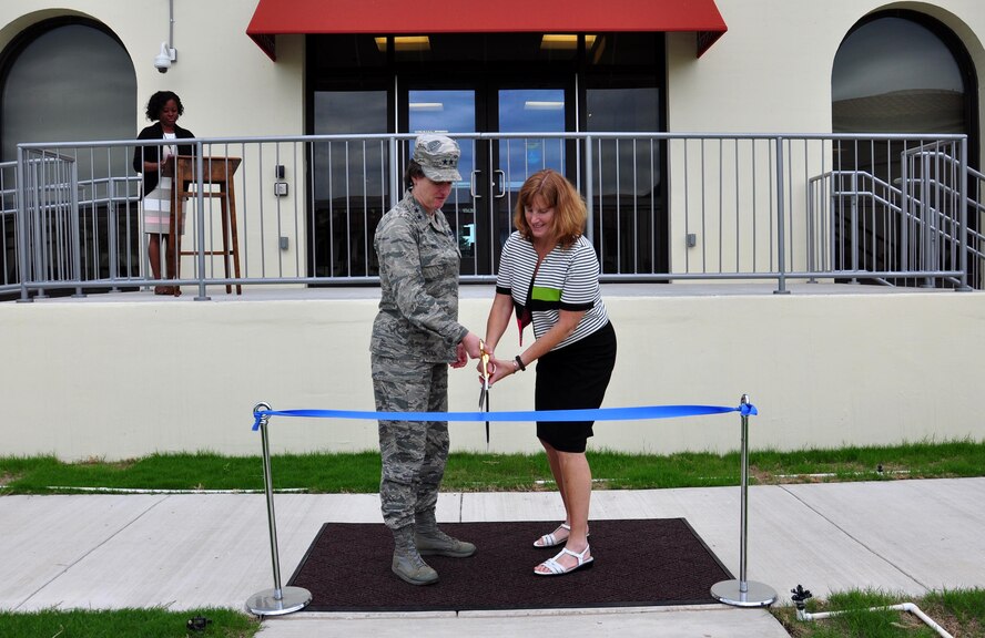 U.S. Air Force Maj. Gen. Peggy Poore, Air Force Personnel Center commander, and Kimberly Toney, AFPC executive director, perform the official ribbon cutting marking the finalization of AFPC’s courtyard project May 23, 2017, at Joint Base San Antonio-Randolph, Texas. The project involved two general contractors, 32 subcontractors, and more than 71,000 man hours throughout three phases. (U.S. Air Force photo by Staff Sgt. Alexx Pons)