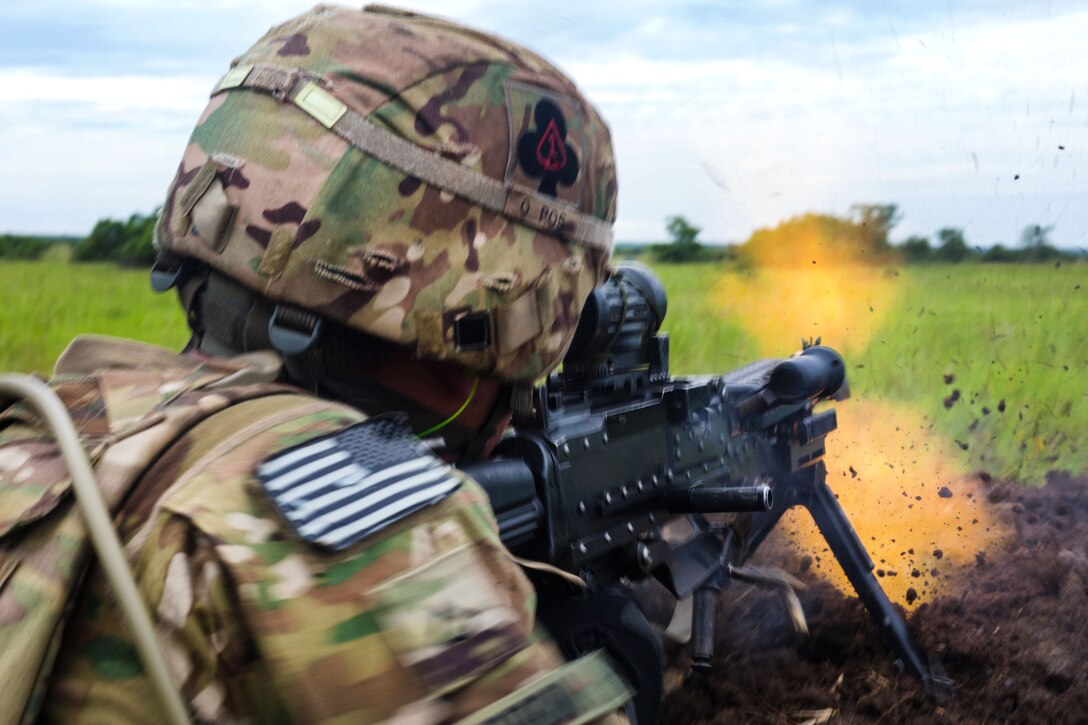 A soldier fires his machine gun during a live-fire exercise that's part of United Accord 2017 at Bundase Training Camp, Bundase, Ghana, May 26, 2017. Army photo by Spc. Victor Perez Vargas