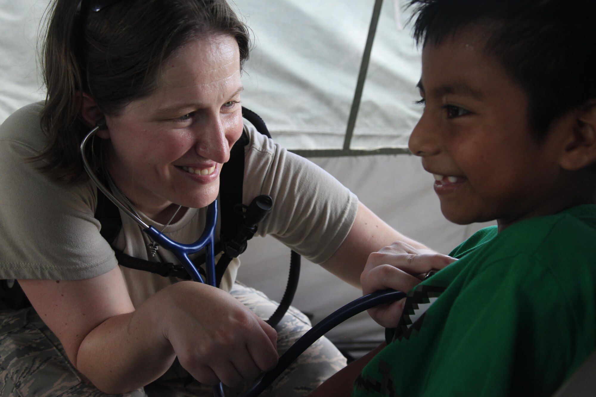 U.S. Air Force Capt. Katie Coble, 96th Medical Group, checks a patient's heart beat at a medical readiness event in Dangriga, Belize, May 22, 2017. This is the third and final medical event for Beyond the Horizon 2017, a U.S. Southern Command-sponsored, Army South-led exercise designed to provide humanitarian and engineering services to communities in need, demonstrating U.S. support for Belize. (U.S. Army photo by Spc. Kelson Brooks)