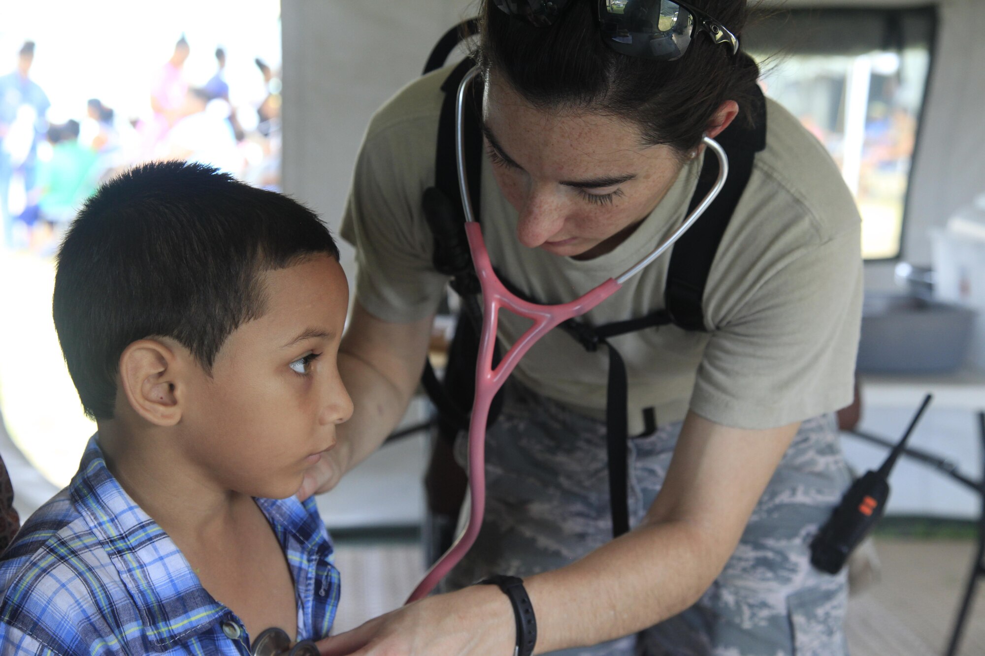 U.S. Air Force Capt. Sabrina Silver, 96th Medical Group, checks a patient's heart beat at a medical readiness event in Dangriga, Belize, May 22, 2017. This is the third and final medical event scheduled for Beyond the Horizon 2017, a U.S. Southern Command-sponsored, Army South-led exercise designed to provide humanitarian and engineering services to communities in need, demonstrating U.S. support for Belize. (U.S. Army photo by Spc. Kelson Brooks)