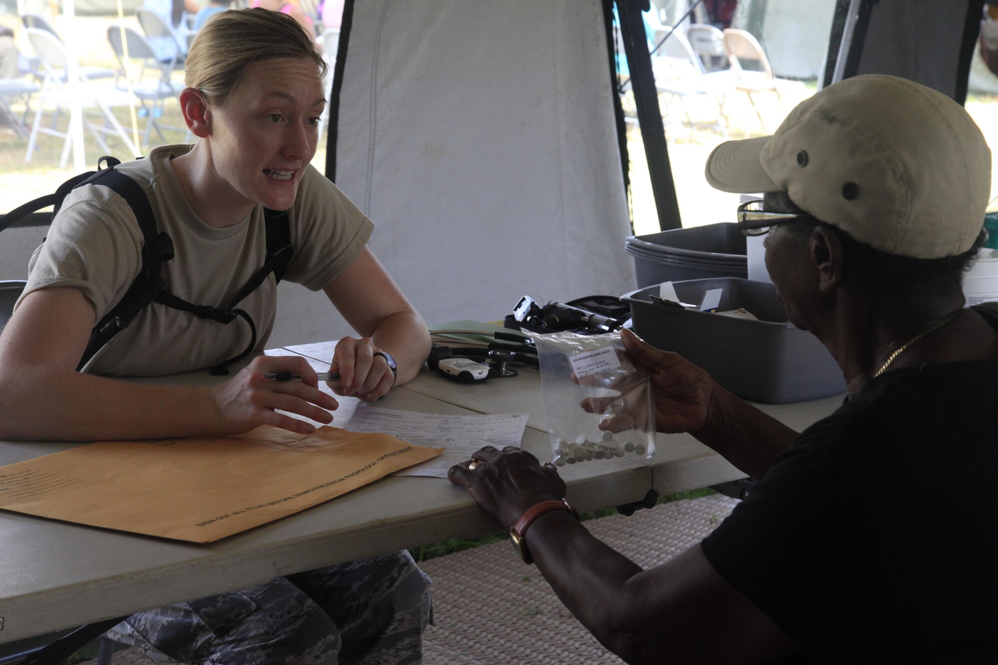 U.S. Air Force Capt. Glynnis Knobloch, 96th Medical Group, prescribes medicine to a patient at a medical readiness event in Dangriga, Belize, May 22, 2017. This is the third and final medical event scheduled for Beyond the Horizon 2017, a U.S. Southern Command-sponsored, Army South-led exercise designed to provide humanitarian and engineering services to communities in need, demonstrating U.S. support for Belize. (U.S. Army photo by Spc. Kelson Brooks)