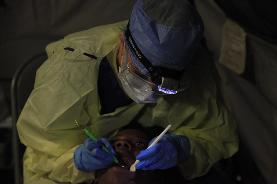 U.S. Air Force Staff Sgt. Shannon Roaymakers, 96th Medical Group, performs a teeth cleaning at a medical readiness event in Dangriga, Belize, May 22, 2017. This is the third and final medical event scheduled for Beyond the Horizon 2017, a U.S. Southern Command-sponsored, Army South-led exercise designed to provide humanitarian and engineering services to communities in need, demonstrating U.S. support for Belize. (U.S. Army photo by Spc. Kelson Brooks)