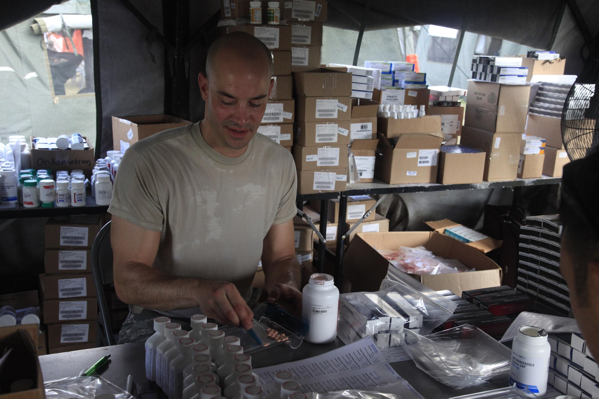 U.S. Air Force Tech Sgt. Bryan Kopco, 96th Medical Group, fills prescription bags at a medical readiness event during in Dangriga, Belize, May 22, 2017. This is the third and final medical event scheduled for Beyond the Horizon 2017, a U.S. Southern Command-sponsored, Army South-led exercise designed to provide humanitarian and engineering services to communities in need, demonstrating U.S. support for Belize. (U.S. Army photo by Spc. Kelson Brooks)
