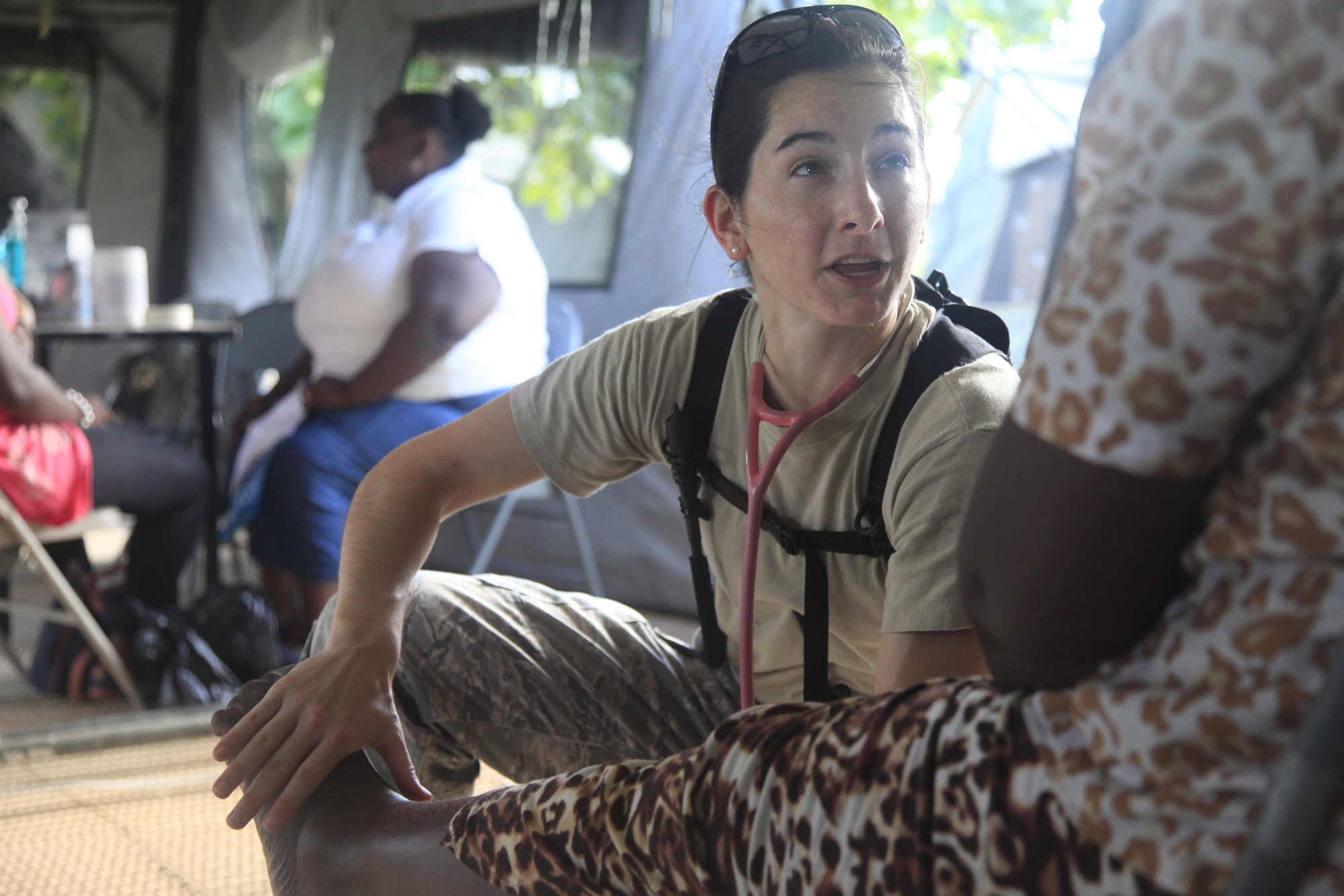 U.S. Air Force Capt. Sabrina Silver, 96th Medical Group, checks a patient's foot at a medical readiness event in Dangriga, Belize, May 22, 2017. This is the third and final medical event scheduled for Beyond the Horizon 2017, a U.S. Southern Command-sponsored, Army South-led exercise designed to provide humanitarian and engineering services to communities in need, demonstrating U.S. support for Belize. (U.S. Army photo by Spc. Kelson Brooks)