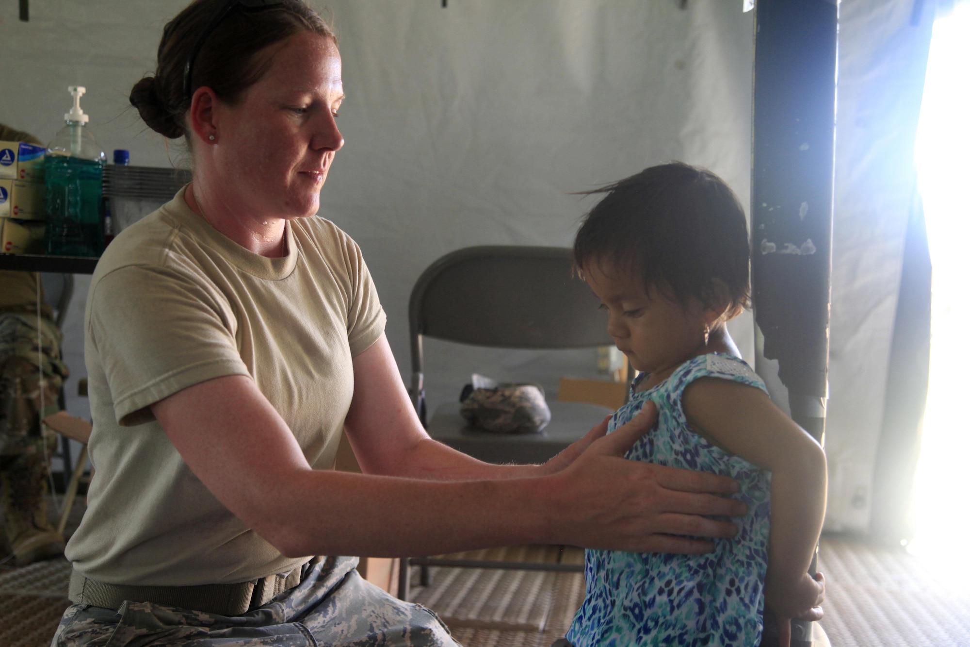 U.S. Air Force Master Sgt. Laura Winn, 96th Medical Group, measures a patient's height, at a medical readiness event in Dangriga, Belize, May 22, 2017. This is the third medical and final event scheduled for Beyond the Horizon 2017, a U.S. Southern Command-sponsored, Army South-led exercise designed to provide humanitarian and engineering services to communities in need, demonstrating U.S. support for Belize. (U.S. Army photo by Spc. Kelson Brooks)
