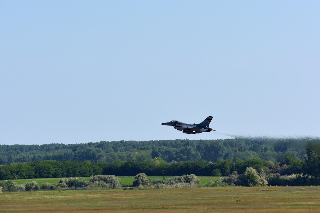 An F-16 Fighting Falcon aircraft takes off during exercise Load Diffuser 17 at Kecskemet Air Base, Hungary, May 26, 2017. The pilots are assigned to the Ohio Air National Guard’s 180th Fighter Wing. More than 150 airmen and eight F-16s are participating in the two-week multinational exercise focused on enhancing interoperability capabilities and skills among NATO allied and European partner air forces by conducting joint operations and air defenses to maintain joint readiness. Air National Guard photo by Air Force Senior Master Sgt. Beth Holliker