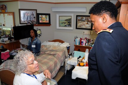 Maj. Angela Reed-Johnson, strategic operations chief for the Directorate of Human Resources for the U.S. Army Reserve’s 99th Regional Support Command at Joint Base McGuire-Dix-Lakehurst, New Jersey, visits May 26 with Edith Cobb at the Veterans Memorial Home in Vineland, New Jersey.  Cobb was at the 99th RSC’s dining out on May 12, an event to which dozens of residents from the home were invited.