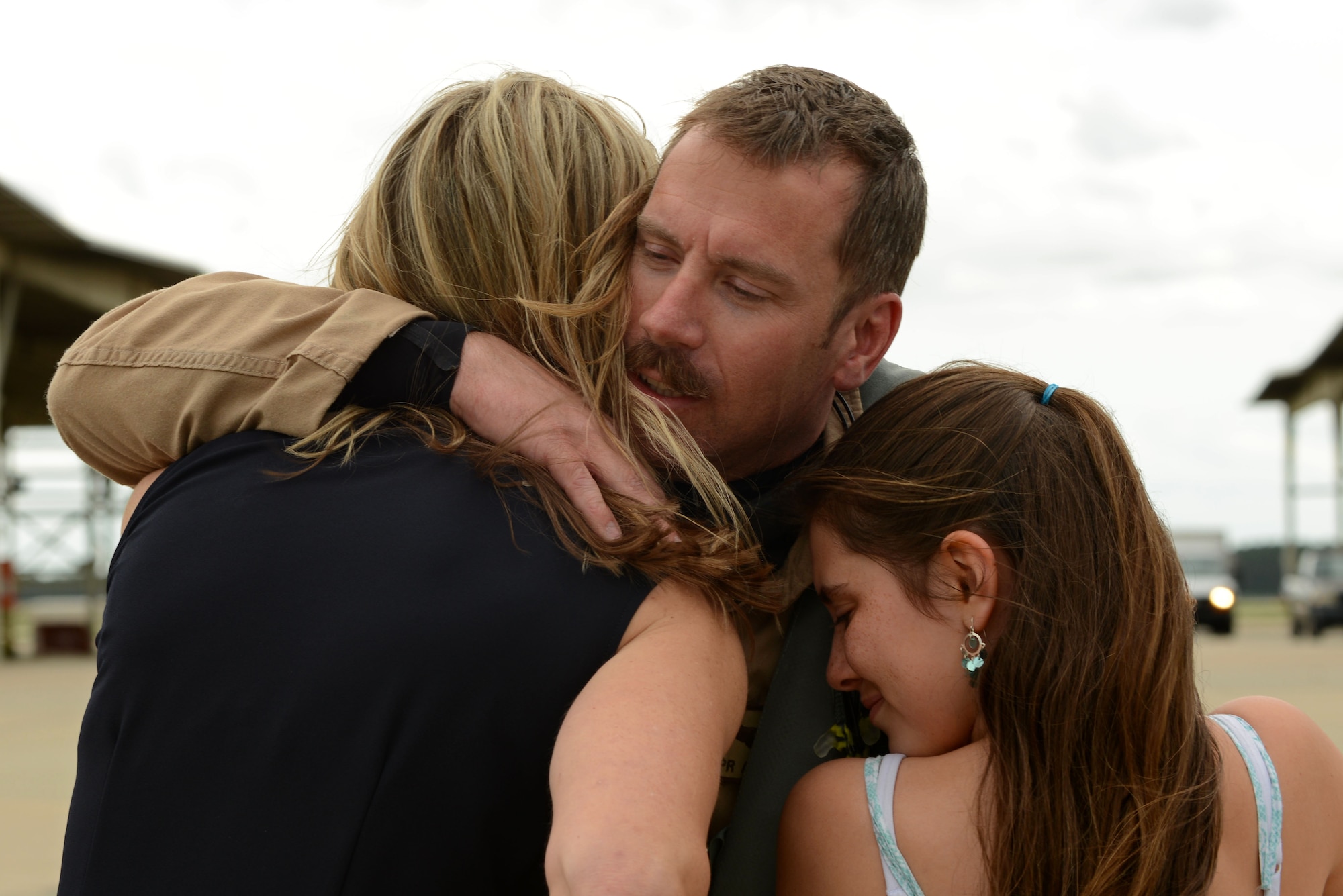 Lt. Col. Craig Andrle, 79th Fighter Squadron (FS) commander, embraces his family on the Shaw Air Force Base, S.C., flightline after returning from a deployment May 4, 2017. As commander, Andrle brought 45 members of the 79th FS with him to Bagram, as well as 300 Shaw maintainers to keep the 79th’s F-16s armed and airworthy. (U.S. Air Force photo by Airman 1st Class Kathryn R.C. Reaves)